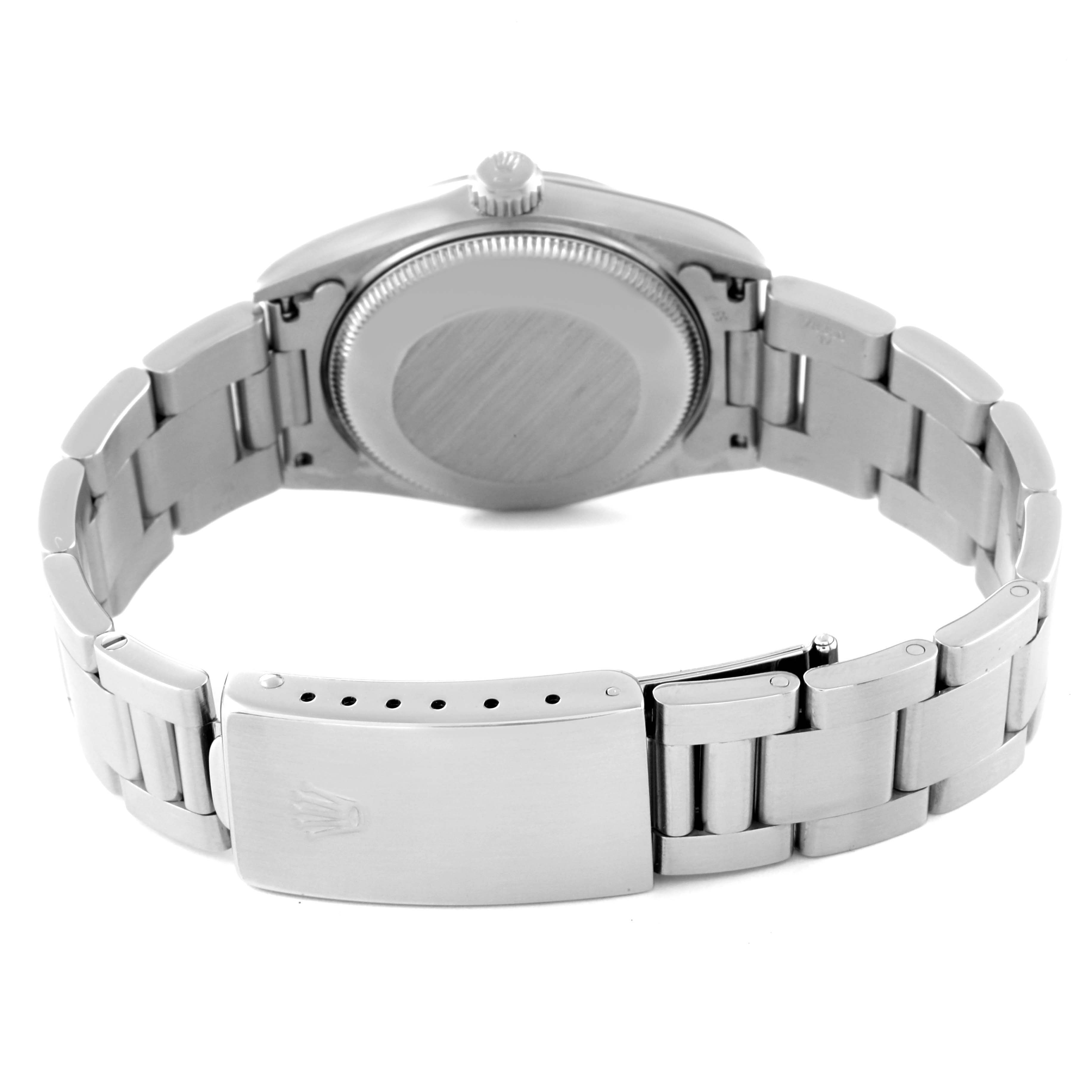 The image shows the back case and bracelet clasp of the Rolex Mid-Size 67480 Women
s Stainless Steel Black Dial 67480 Women
s Stainless Steel Black Dial watch.