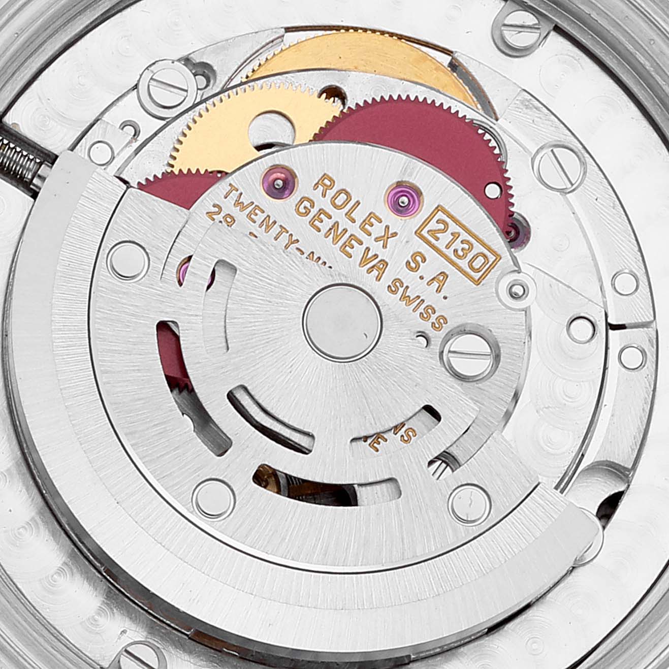 The image shows a close-up of the movement mechanism of a Mid-Size Rolex watch, highlighting its intricate gears and components.