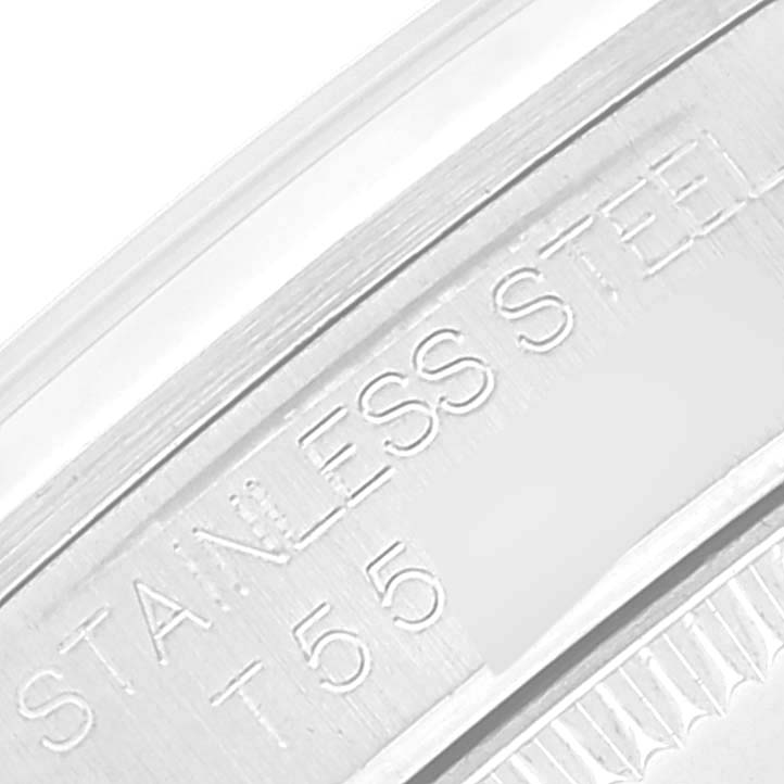 The image shows an up-close view of the inner bezel with stainless steel engraving on a Mid-Size Rolex watch.