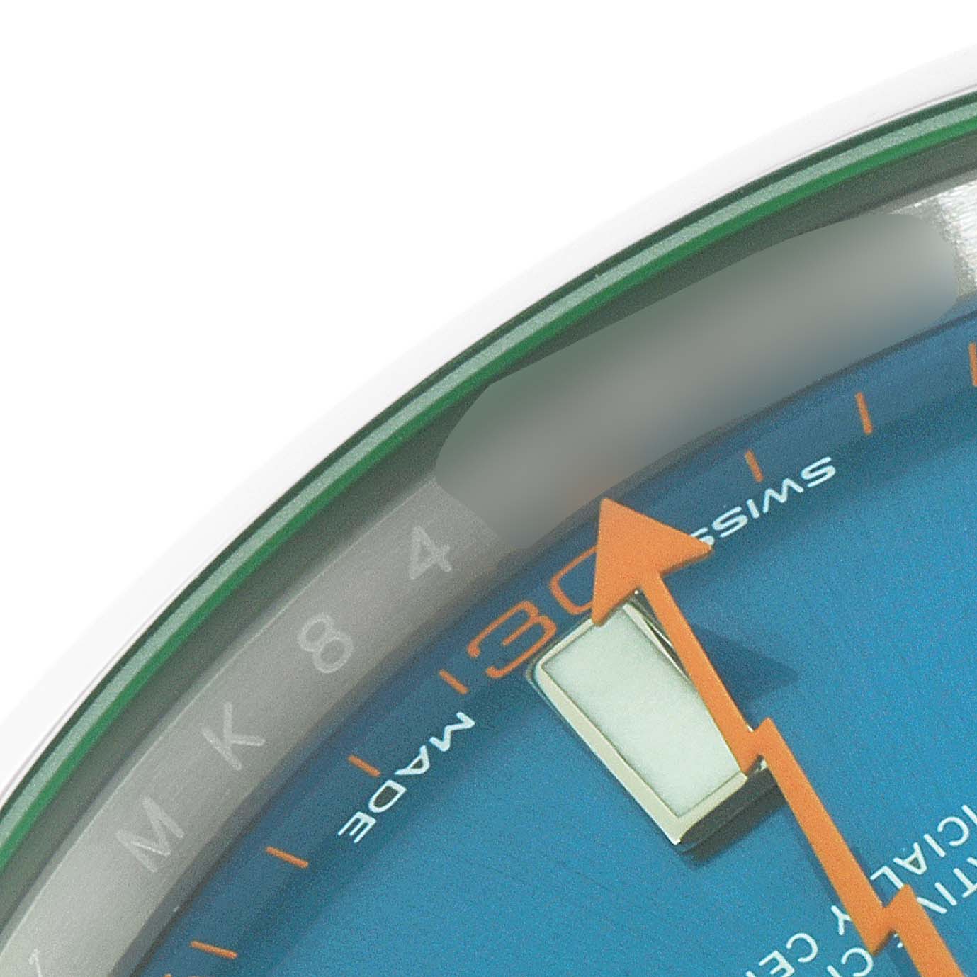 The close-up image shows the dial and orange second hand of the Rolex Milgauss 116400GV Men
s Stainless Steel Blue Dial 116400GV Men
s Stainless Steel Blue Dial watch, focusing on the numbers and text near the edge.