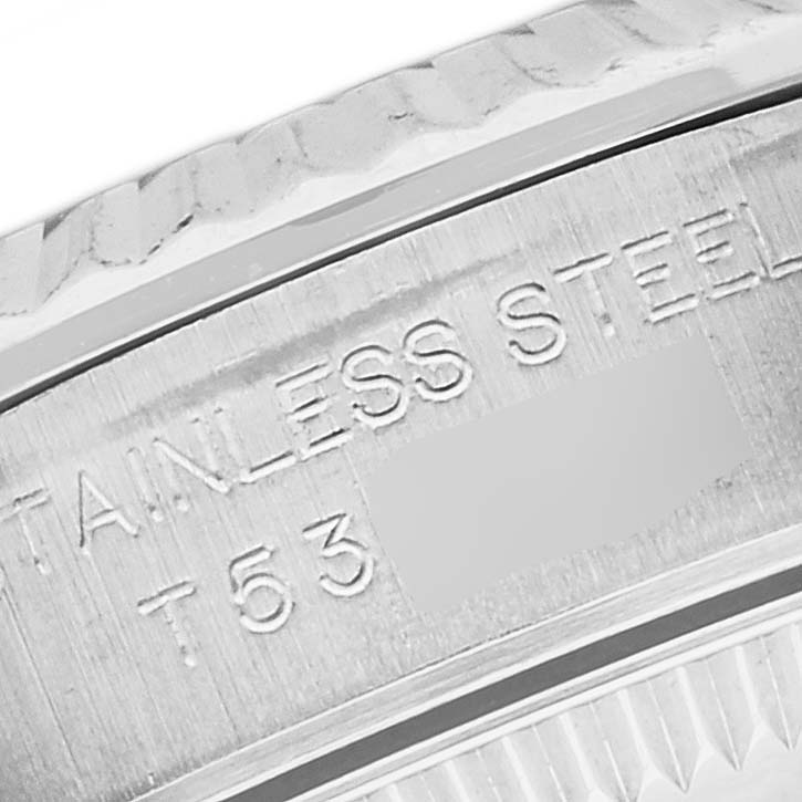 The image shows a close-up of the side engraving on a stainless steel Rolex Oyster Perpetual 67194 Women's Stainless Steel Black Dial 67194 Women's Stainless Steel Black Dial watch.
