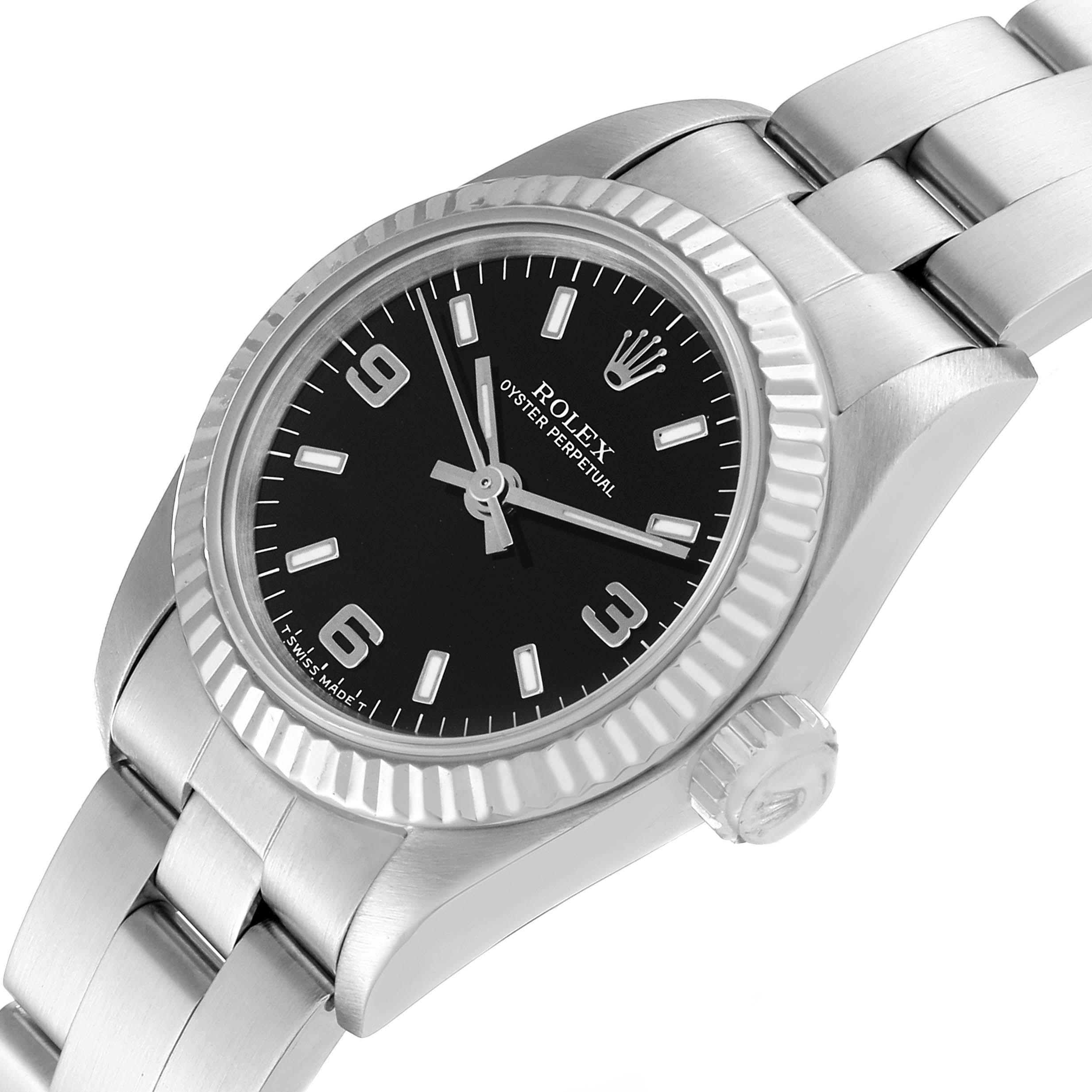 The Rolex Oyster Perpetual 67194 Women's Stainless Steel Black Dial 67194 Women's Stainless Steel Black Dial watch is shown at an angled top view, displaying its dial, bezel, crown, and bracelet.