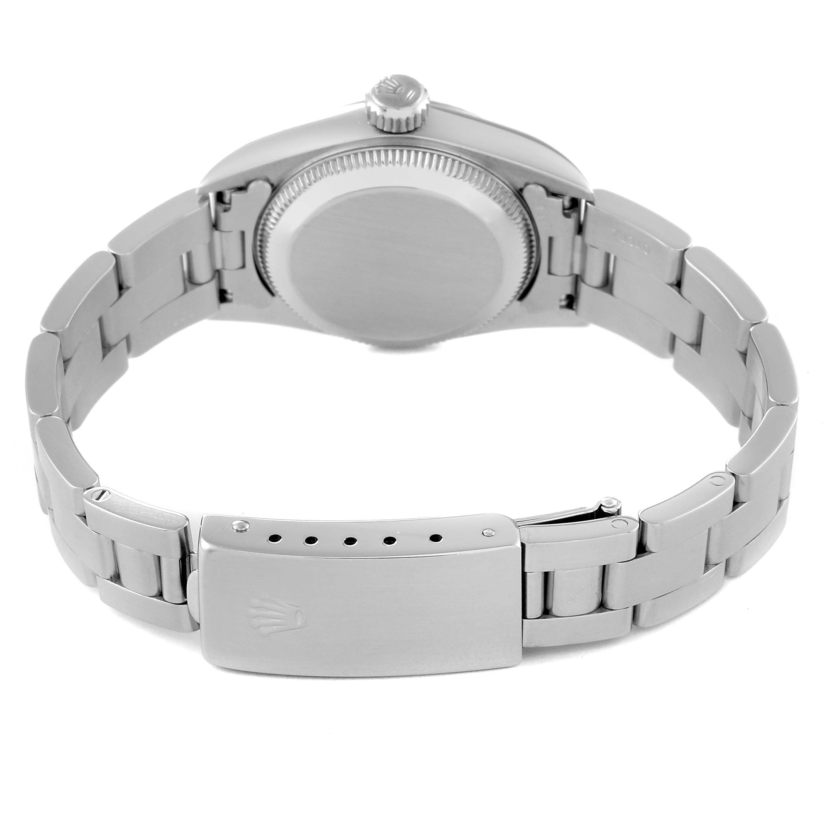 The image shows the back view of a Rolex Oyster Perpetual 67194 Women's Stainless Steel Black Dial 67194 Women's Stainless Steel Black Dial watch, highlighting the case back, crown, and bracelet clasp.