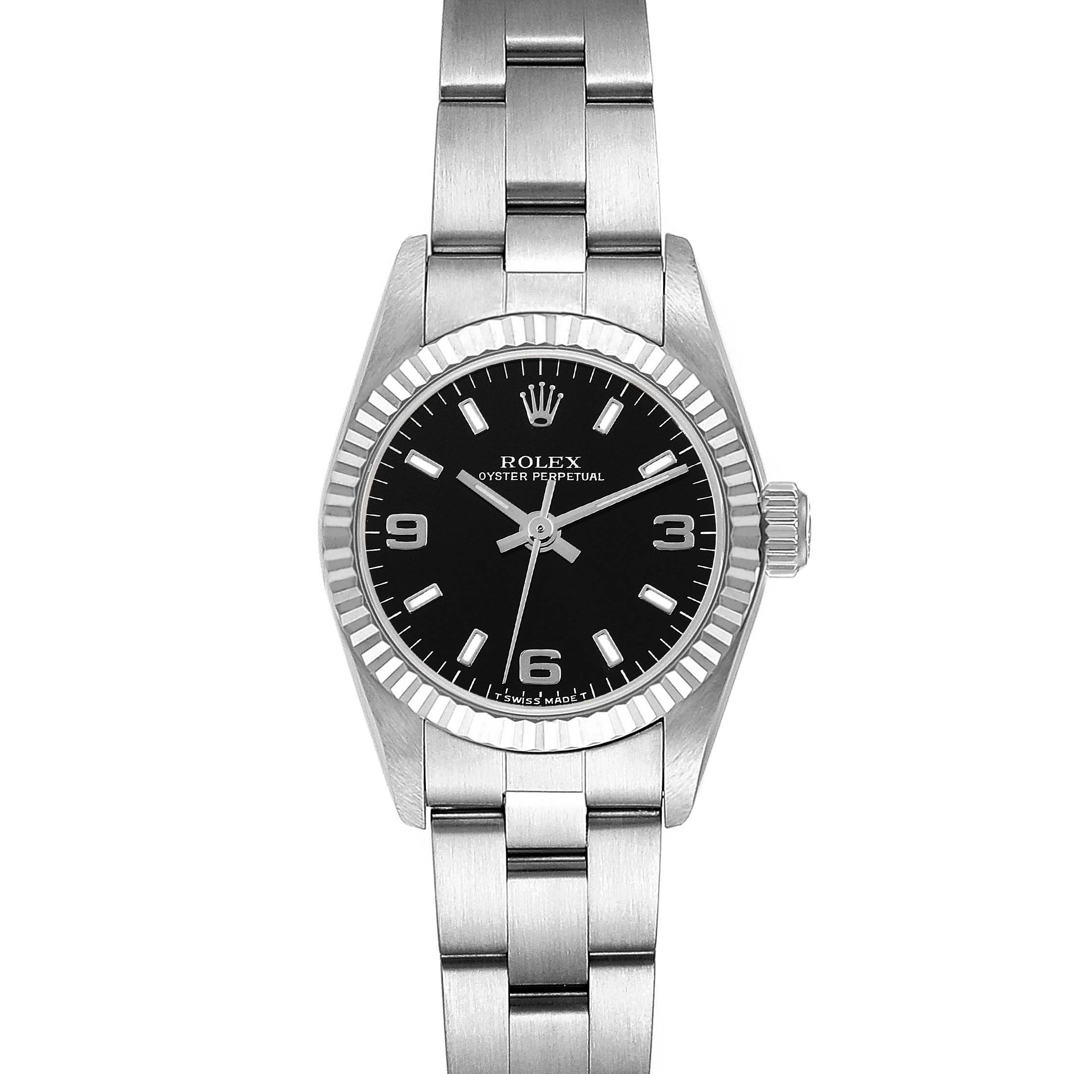 The Rolex Oyster Perpetual 67194 Women's Stainless Steel Black Dial 67194 Women's Stainless Steel Black Dial watch is shown from a front angle, displaying its black dial, hour markers, hands, and stainless steel bracelet.