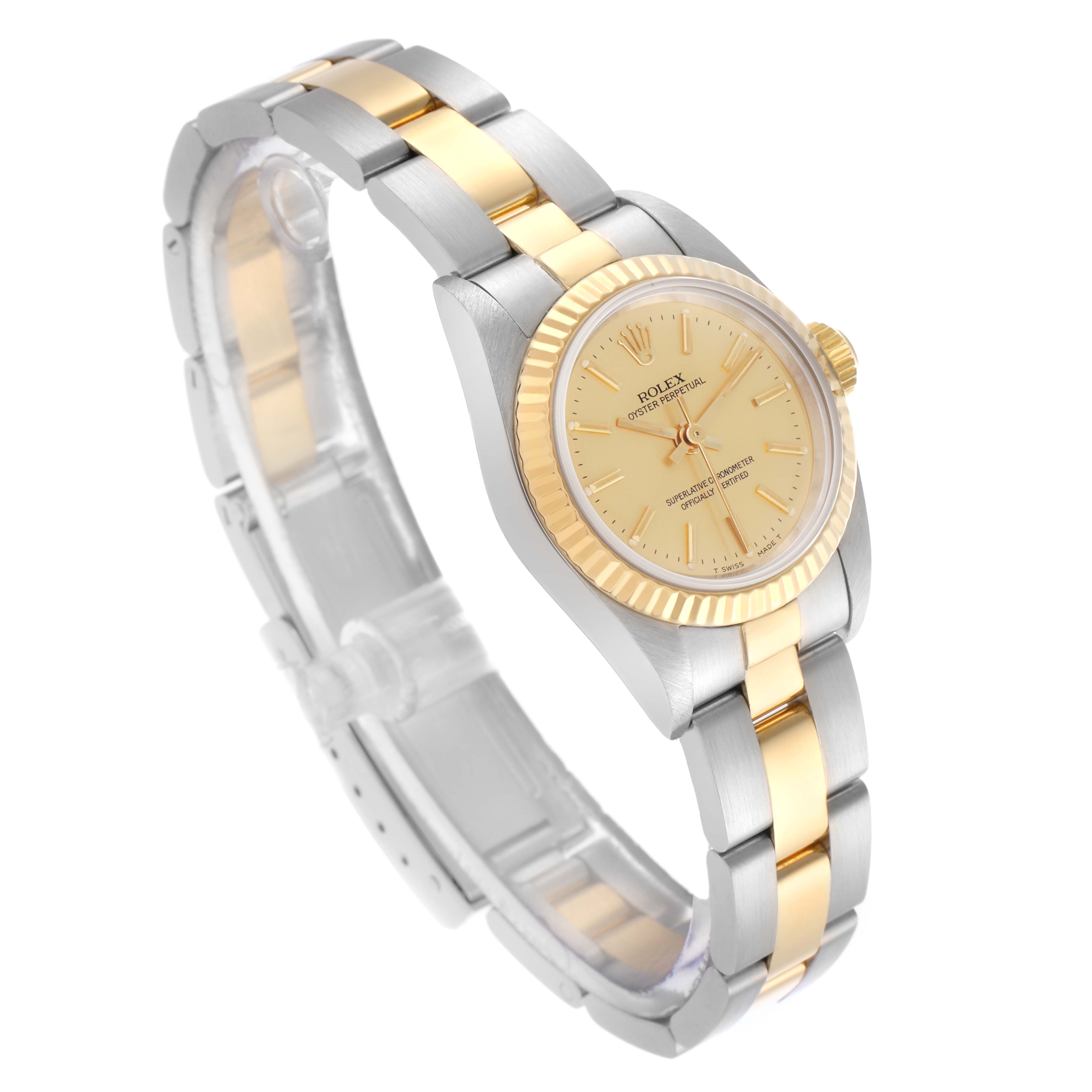 The Rolex Oyster Perpetual 67193 Women's Steel and Gold (two tone) Champagne Dial 67193 Women's Steel and Gold (two tone) Champagne Dial watch is shown at a three-quarter angle, highlighting the dial, bezel, and two-tone bracelet.