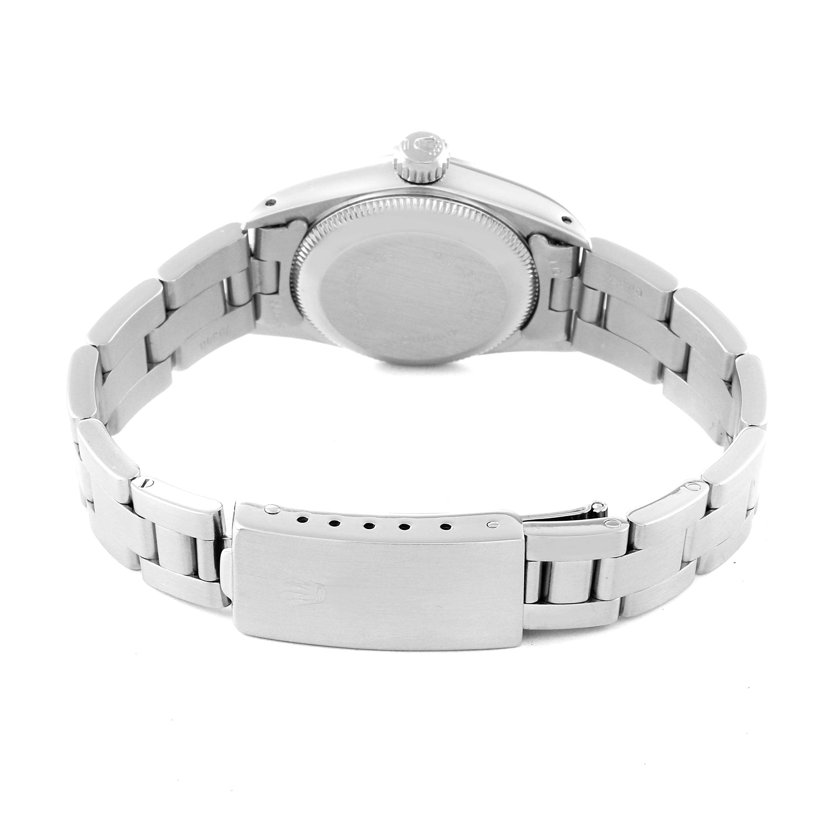 The image shows the back view of a Rolex Oyster Perpetual 67180 Women's Stainless Steel Silver Dial 67180 Women's Stainless Steel Silver Dial watch, highlighting the case back, bracelet, and clasp.