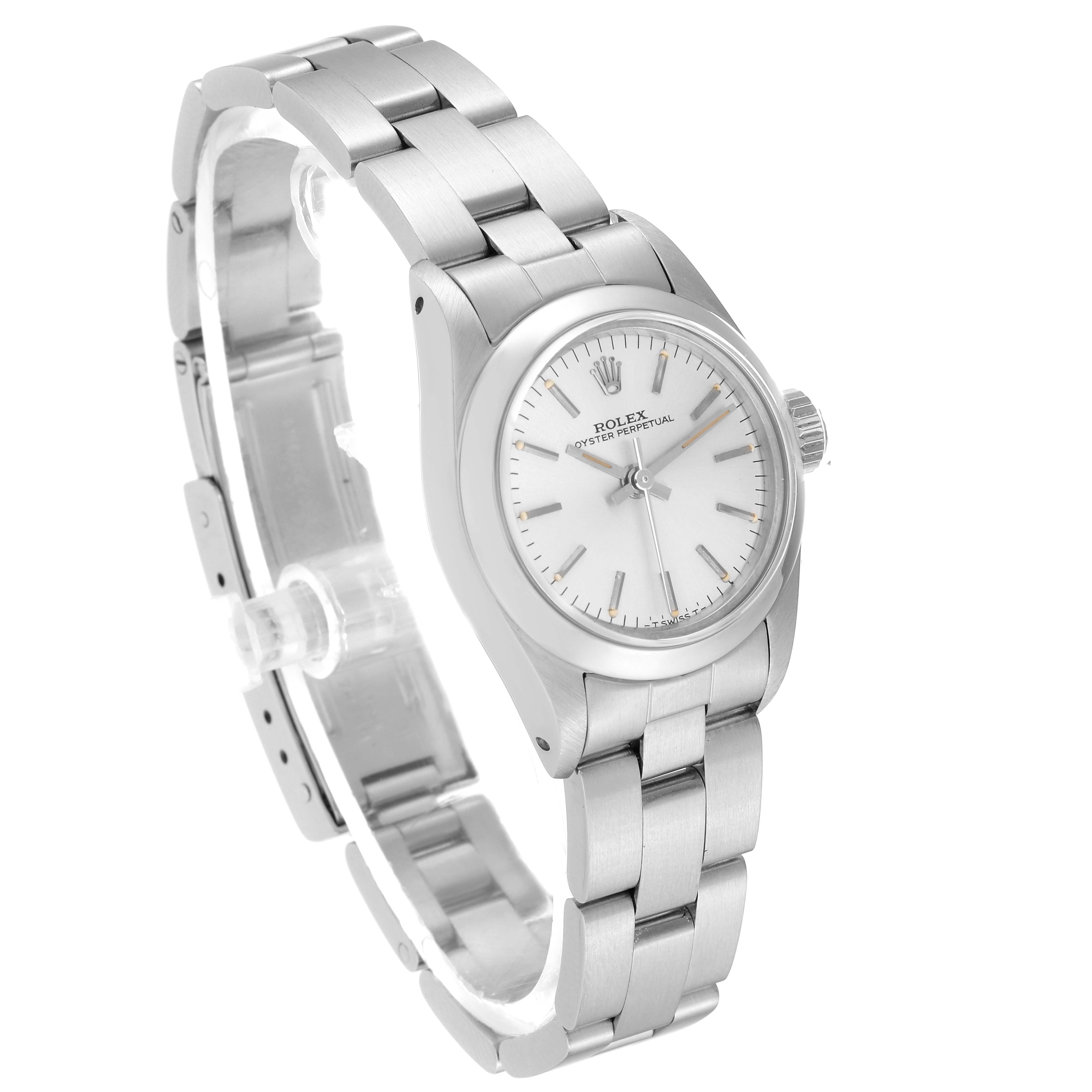 The image shows a side angle of the Rolex Oyster Perpetual 67180 Women's Stainless Steel Silver Dial 67180 Women's Stainless Steel Silver Dial watch, displaying its face, band, and clasp.
