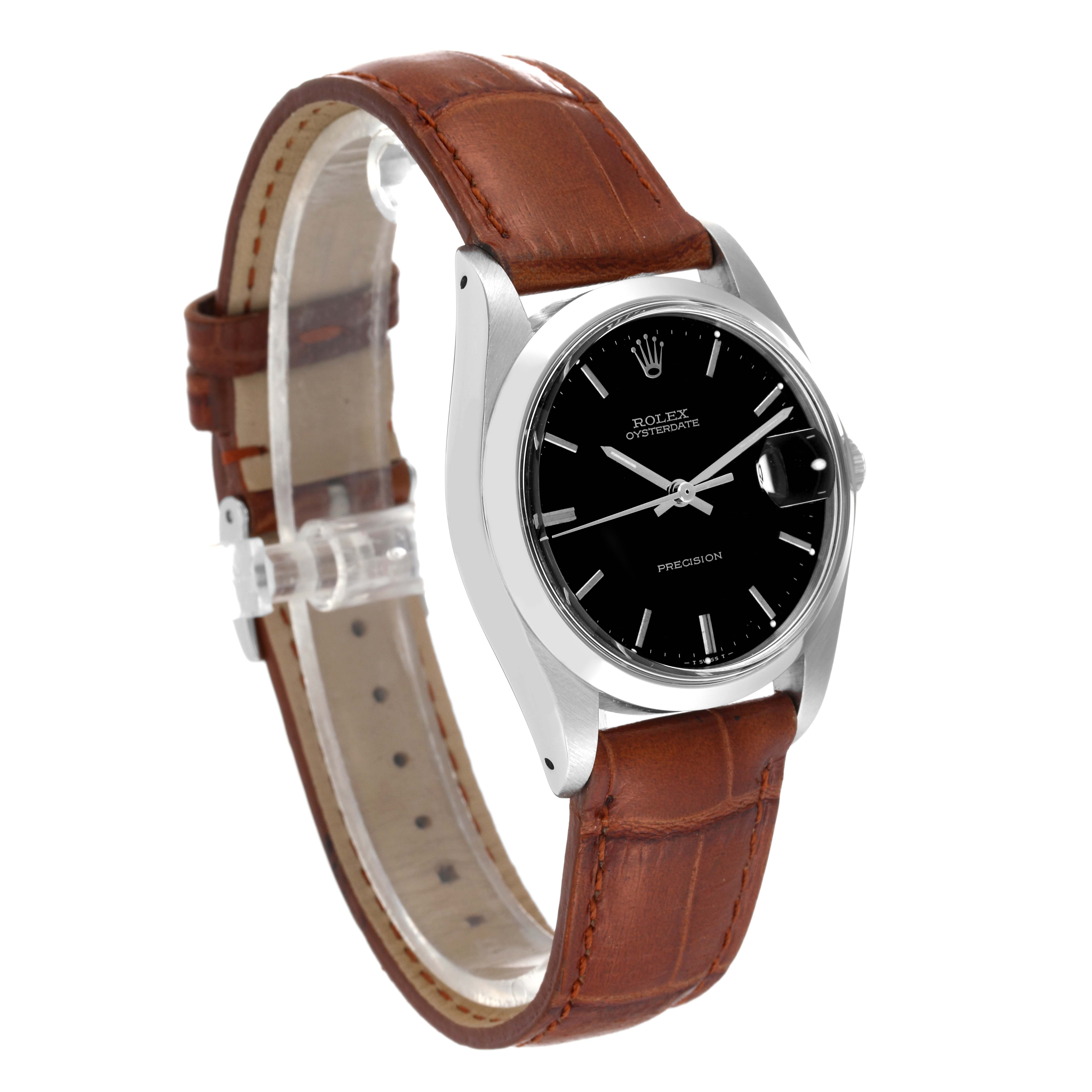 The Vintage Collection Rolex watch is shown at a tilted angle, displaying its black dial, silver case, brown leather strap, and crown.