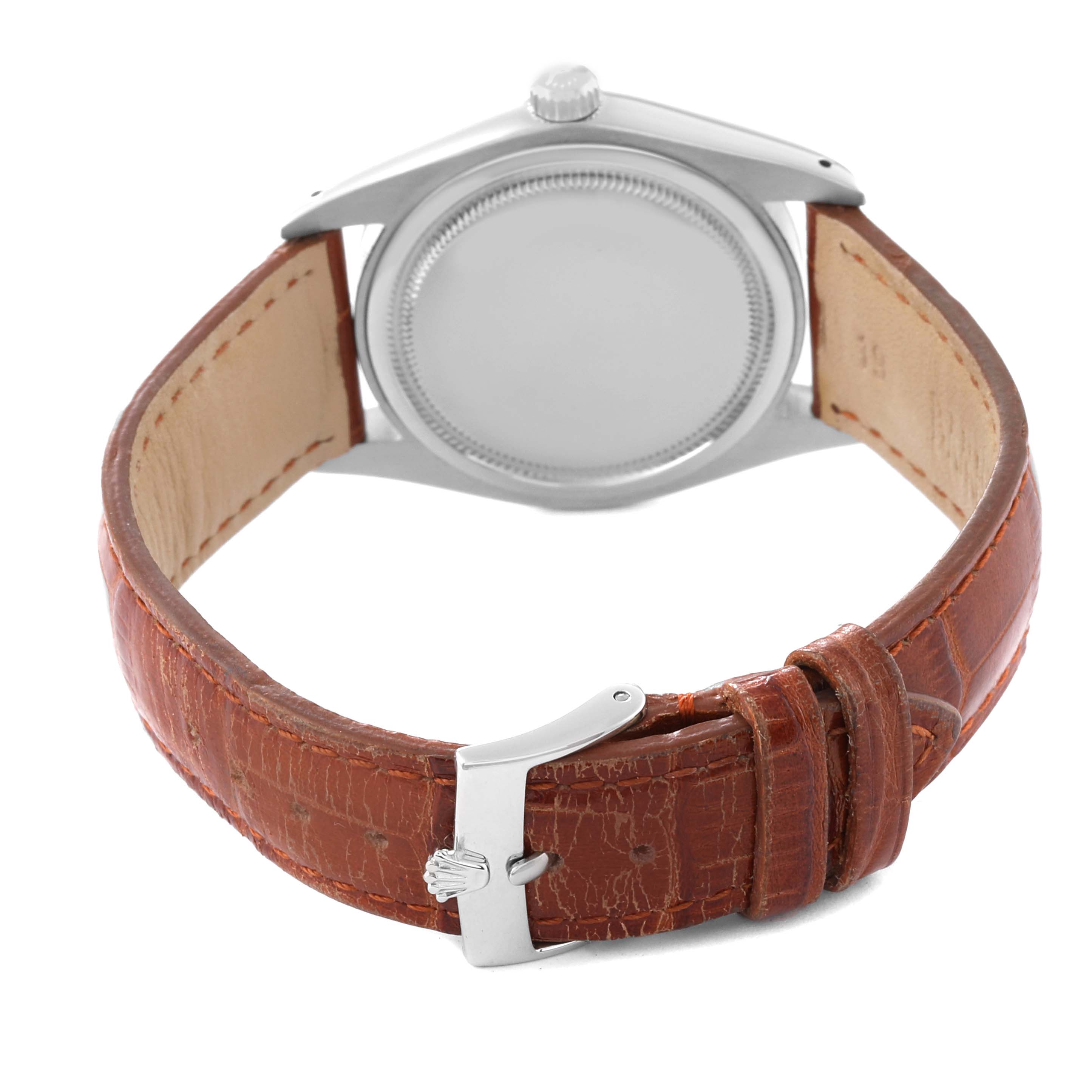 This image shows the back view of a Rolex Vintage Collection 6694 Men's Stainless Steel Black Dial 6694 Men's Stainless Steel Black Dial watch, highlighting its leather strap and clasp.