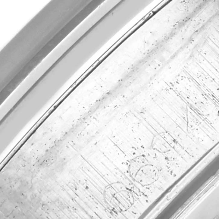 The image shows a close-up of the inner band of a Rolex Date 6694 Men's Stainless Steel Black Dial 6694 Men's Stainless Steel Black Dial model, highlighting engraved markings.