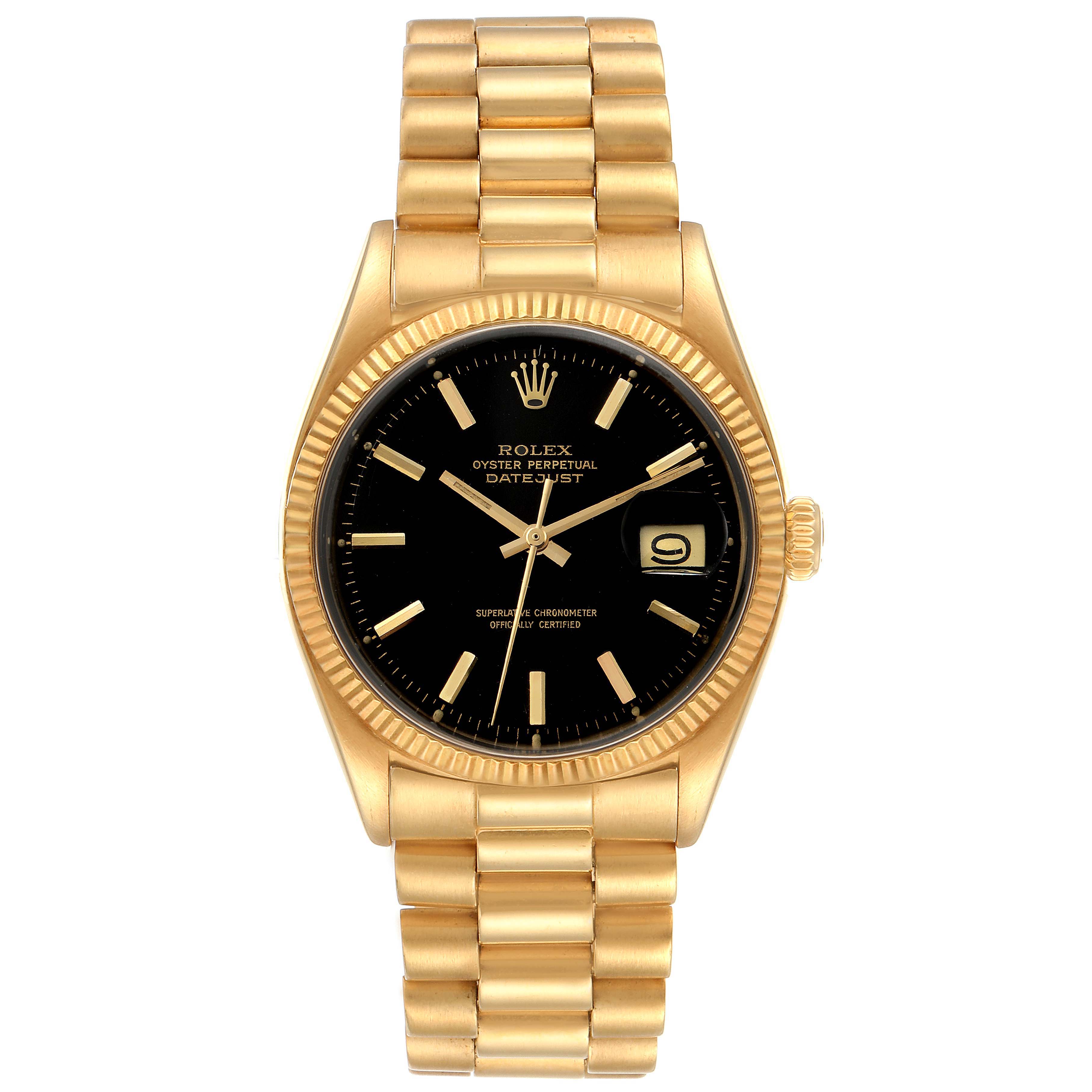 The image shows a front view of a Vintage Collection Rolex Oyster Perpetual Datejust watch with a black dial and gold bracelet.