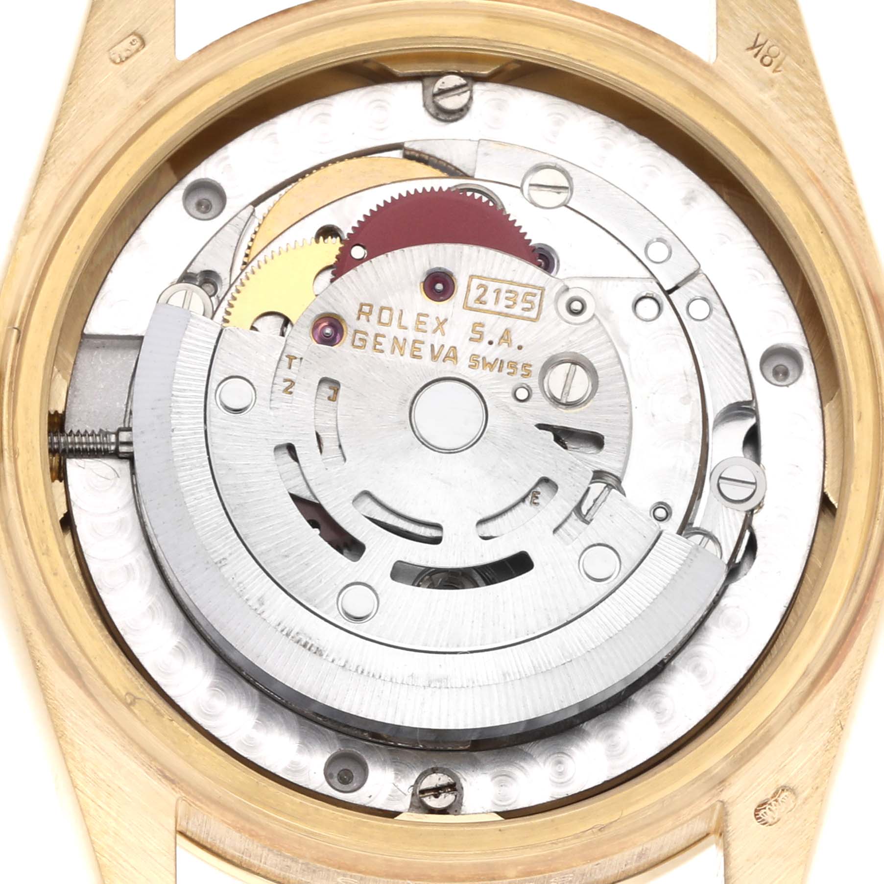 The image shows the movement of a Rolex Mid-Size model from a top-down view, highlighting the internal mechanics.
