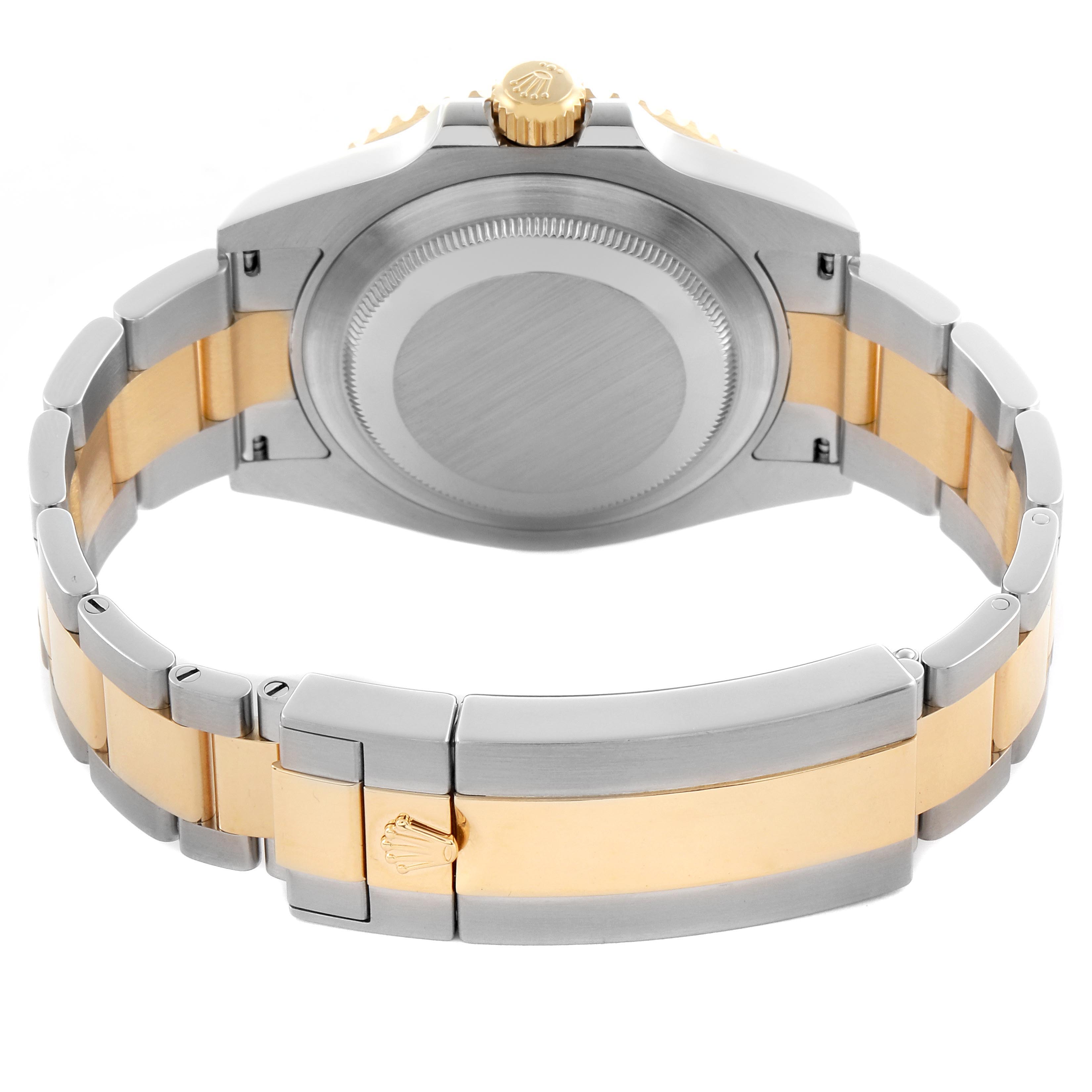 The Rolex Submariner 126613LB Men's Steel and Gold (two tone) Blue Dial 126613LB Men's Steel and Gold (two tone) Blue Dial watch is shown from the back, highlighting the caseback, crown, and the two-tone bracelet with clasp.