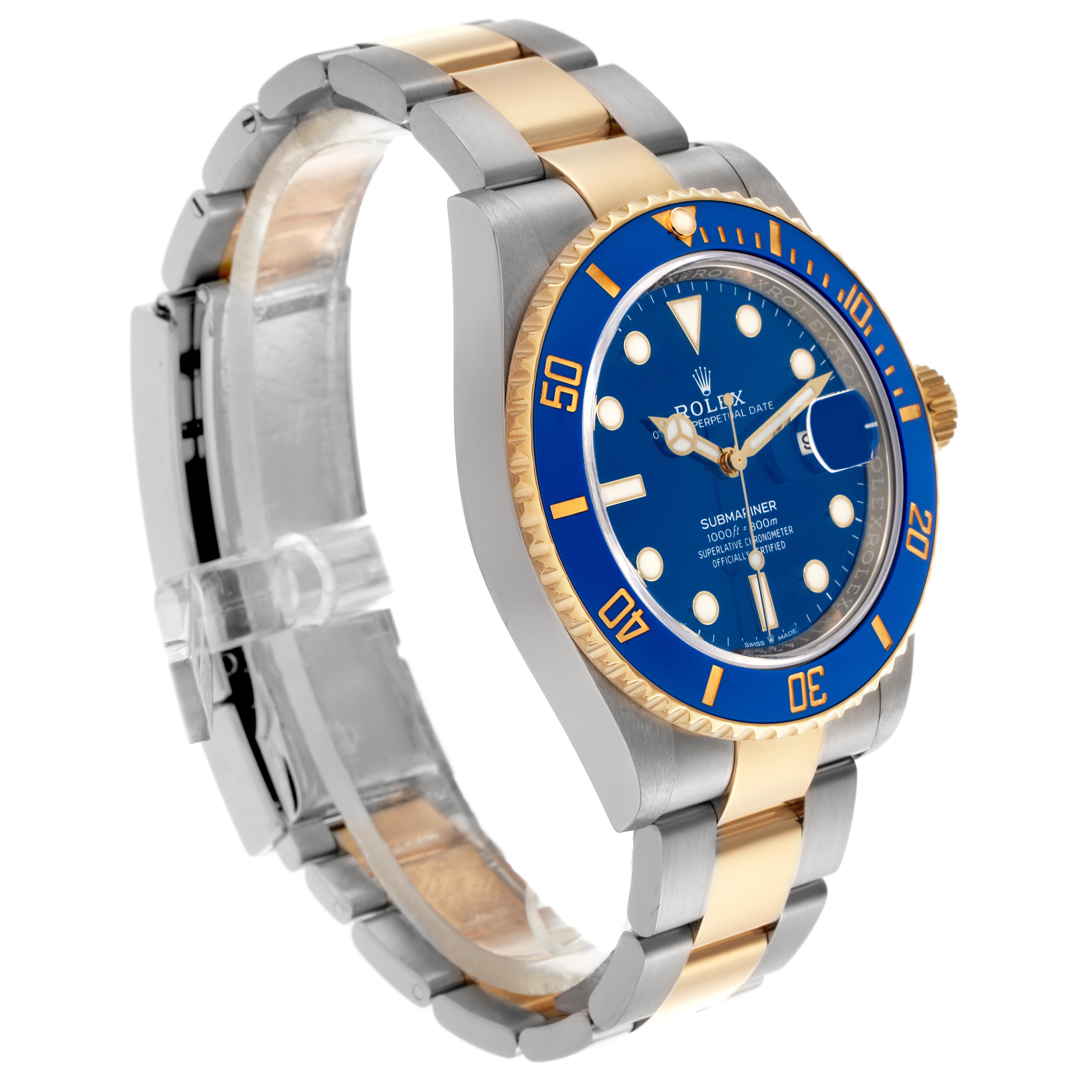 The Rolex Submariner 126613LB Men's Steel and Gold (two tone) Blue Dial 126613LB Men's Steel and Gold (two tone) Blue Dial is shown at a side angle, highlighting the blue dial, bezel, and two-tone bracelet.