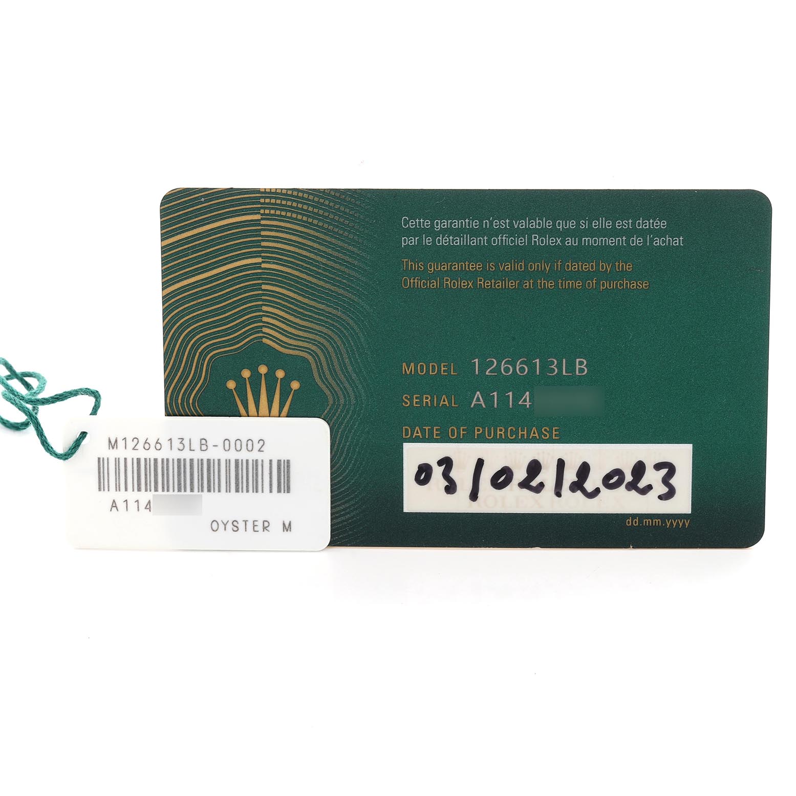 The image shows the warranty card and tag for a Rolex Submariner 126613LB Men's Steel and Gold (two tone) Blue Dial 126613LB Men's Steel and Gold (two tone) Blue Dial model 126613LB.