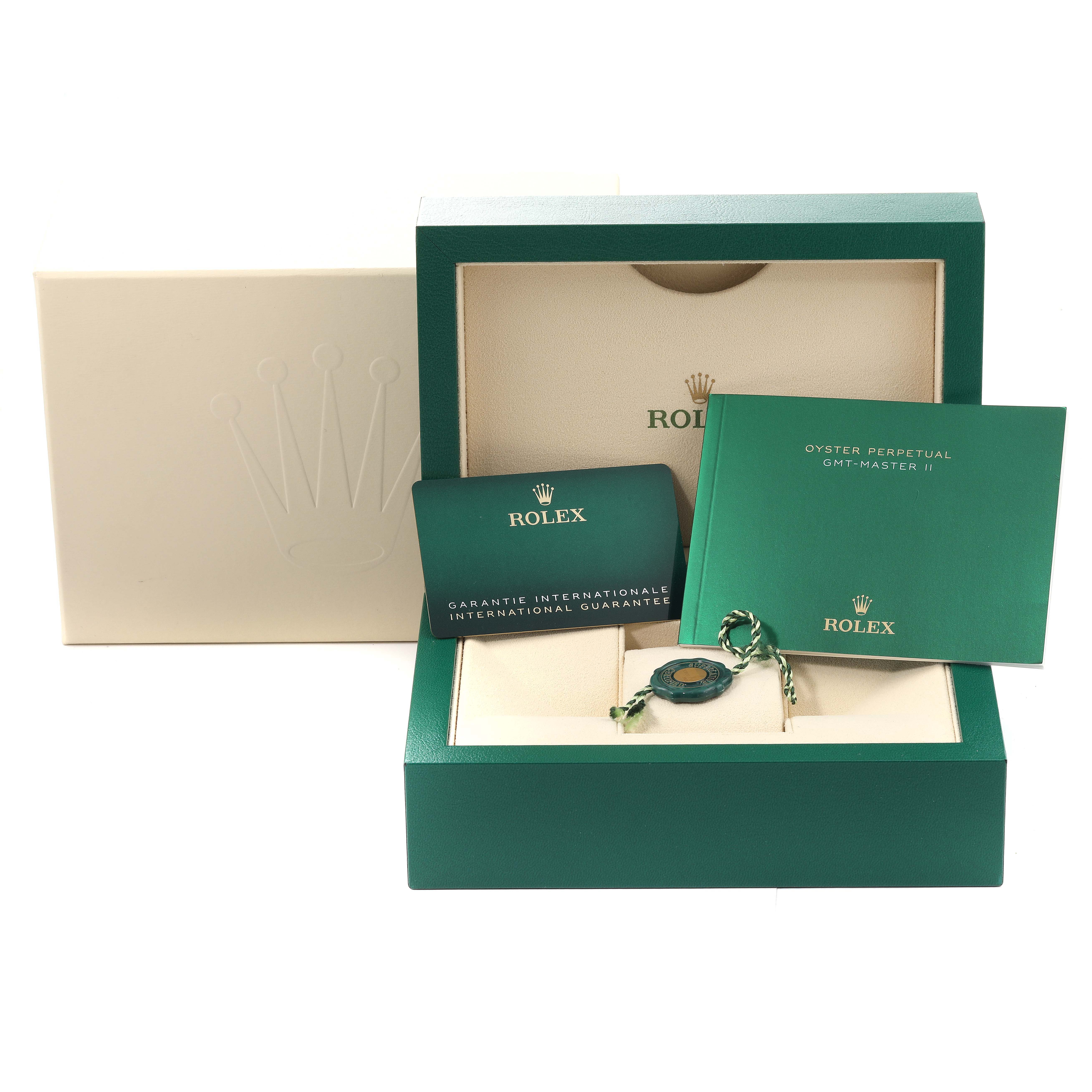 The image shows the packaging and accessories for a Rolex Submariner 126610LN Men
s Stainless Steel Black Dial 126610LN Men
s Stainless Steel Black Dial watch, including the box, warranty card, and manuals.