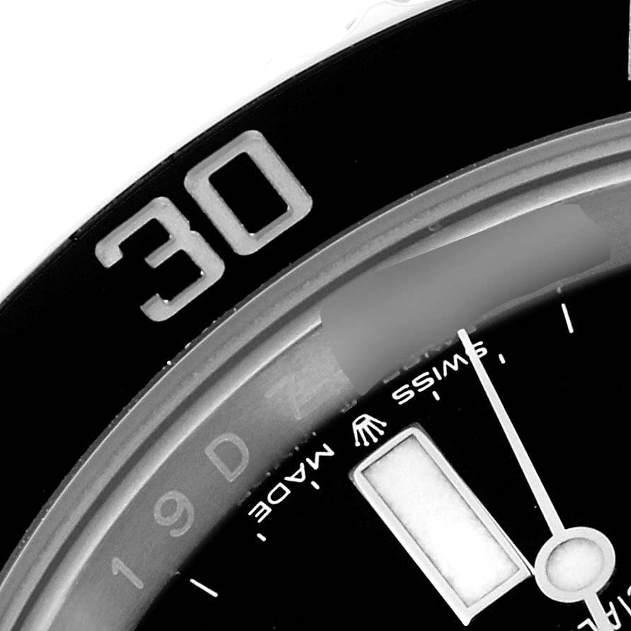 The image shows a close-up of the bezel and part of the dial and hand of a Rolex Submariner 126610LN Men
s Stainless Steel Black Dial 126610LN Men
s Stainless Steel Black Dial watch.