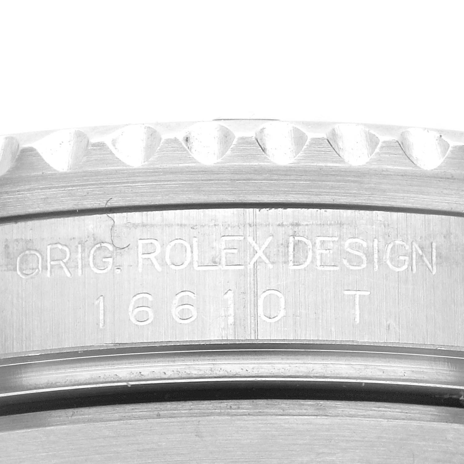 This image shows a close-up of the case side of the Rolex Submariner 16610 Men
s Stainless Steel Black Dial 16610 Men
s Stainless Steel Black Dial watch displaying the engraved model number 16610 T.