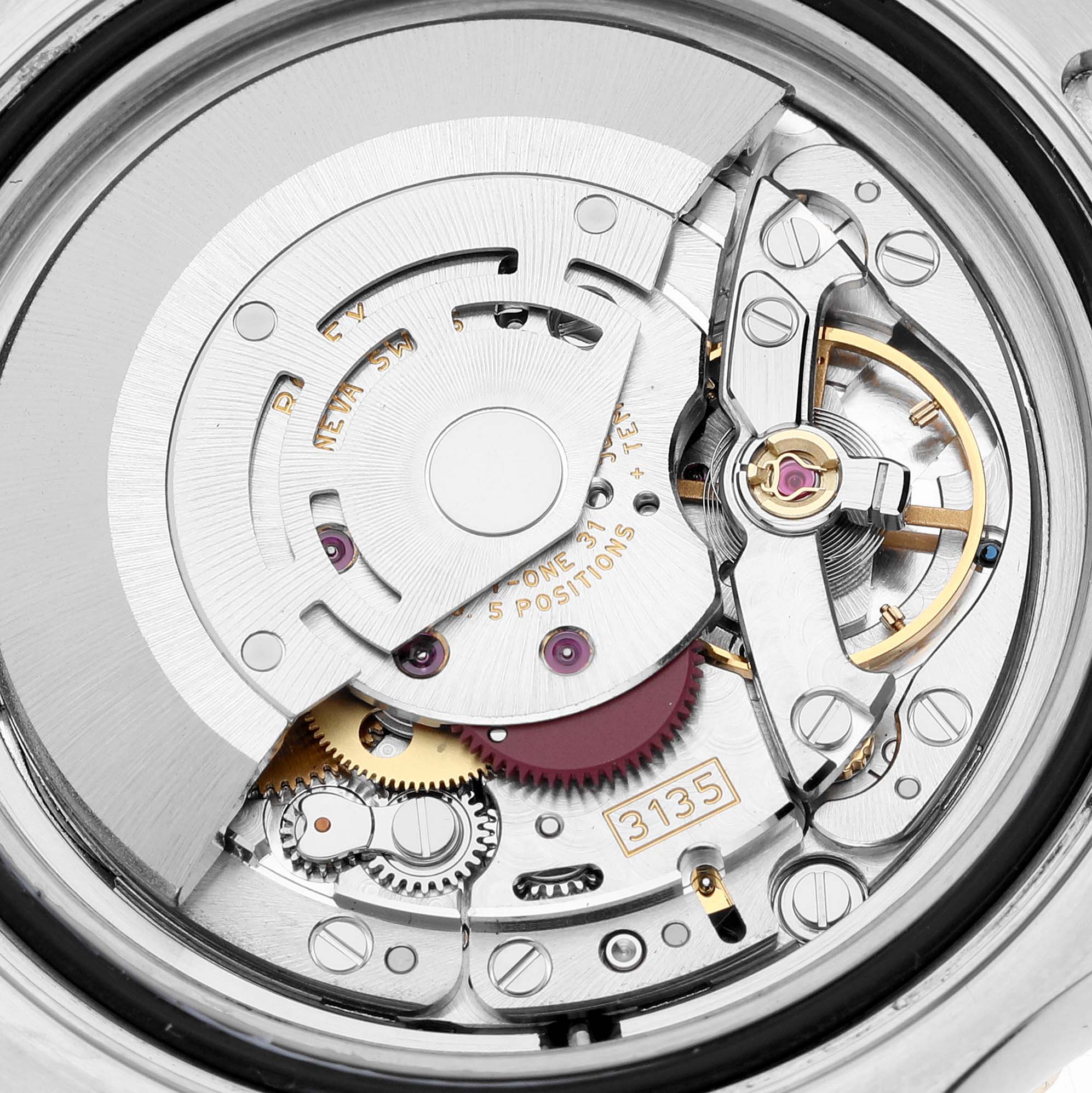 The image shows the internal movement and intricate components of the Rolex Yacht-Master 16623 Men
s Steel and Gold (two tone) White Dial 16623 Men
s Steel and Gold (two tone) White Dial watch, focusing on the mechanism and gears.