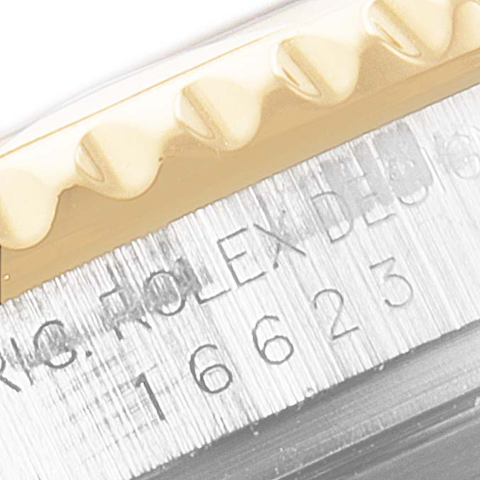 The image shows a close-up of the bezel and model number of the Rolex Yacht-Master 16623 Men
s Steel and Gold (two tone) White Dial 16623 Men
s Steel and Gold (two tone) White Dial watch.