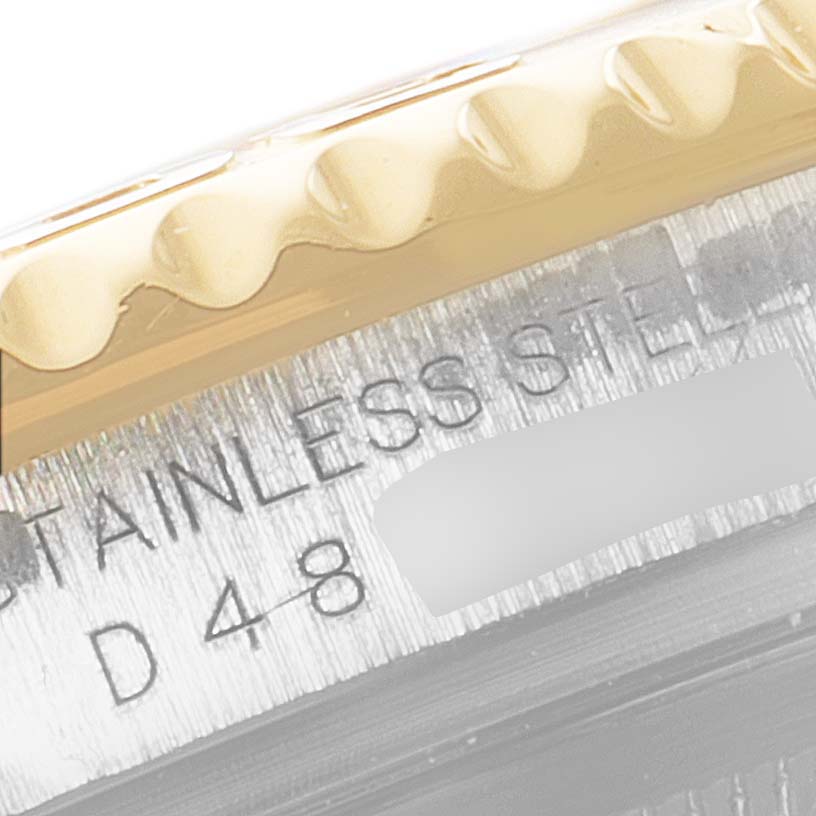 The image shows a close-up of the case and bezel of a Rolex Yacht-Master 16623 Men
s Steel and Gold (two tone) White Dial 16623 Men
s Steel and Gold (two tone) White Dial watch.