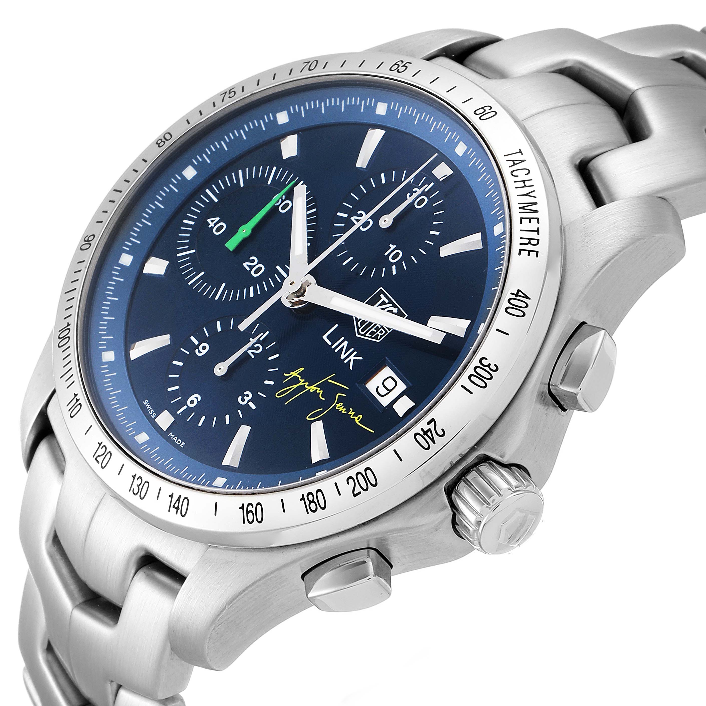 This image shows a Tag Heuer Link model watch from a tilted angle, displaying the dial, bezel, crown, pushers, and metal bracelet.