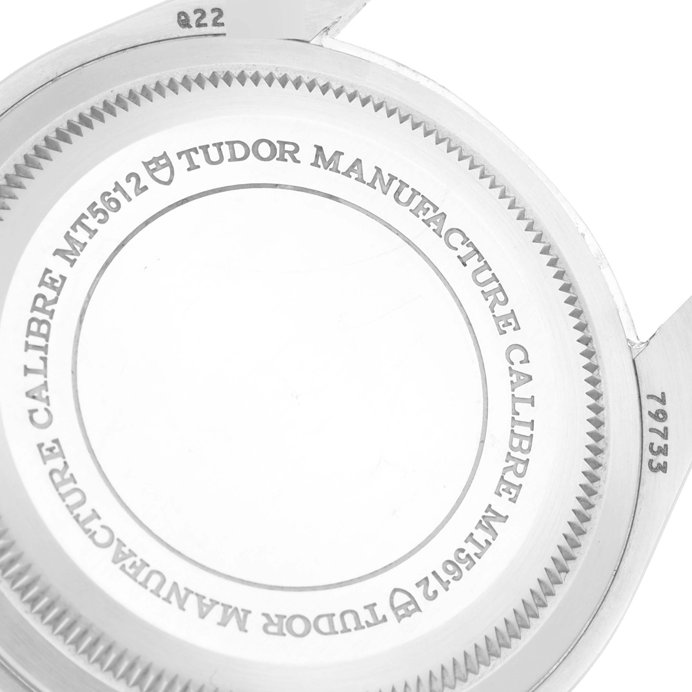 This image shows the back case of the Tudor Heritage Black Bay 79733N Men's Steel and Gold (two tone) Black Dial 79733N Men's Steel and Gold (two tone) Black Dial watch, highlighting the manufacturer engravings.