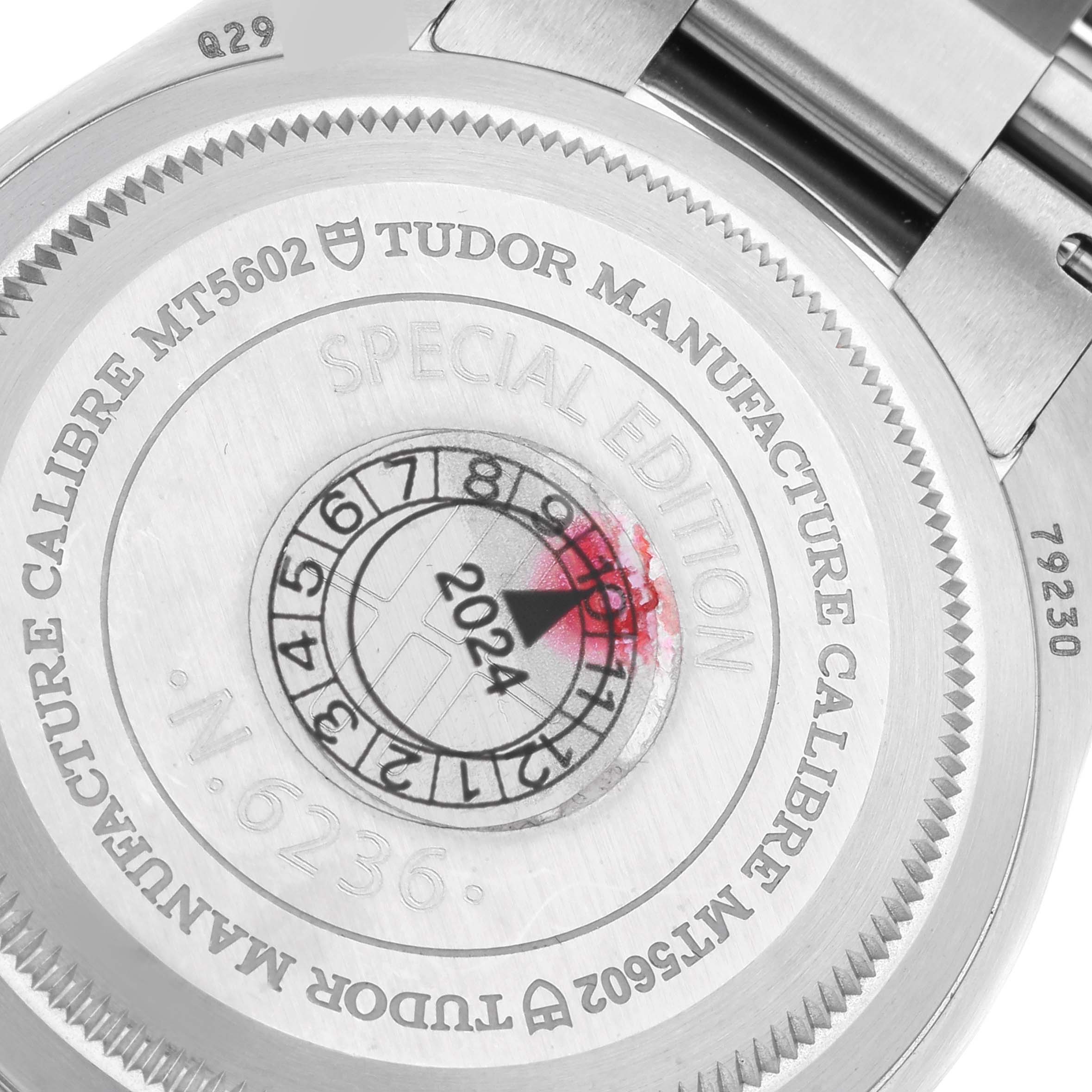 Close-up of the case back of the Tudor Heritage Black Bay 79230G Men
s Stainless Steel Black Dial 79230G Men
s Stainless Steel Black Dial watch, showcasing the engraving details and special edition markings.