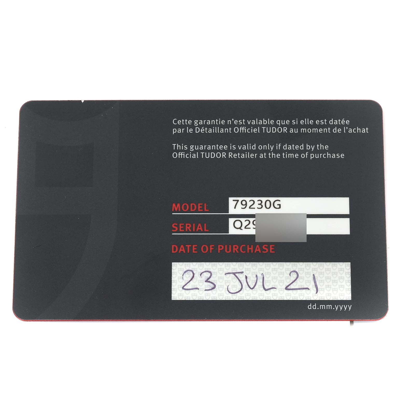 This image shows the warranty card for a Tudor Heritage Black Bay 79230G Men
s Stainless Steel Black Dial 79230G Men
s Stainless Steel Black Dial watch, including the model number, serial number, and purchase date.