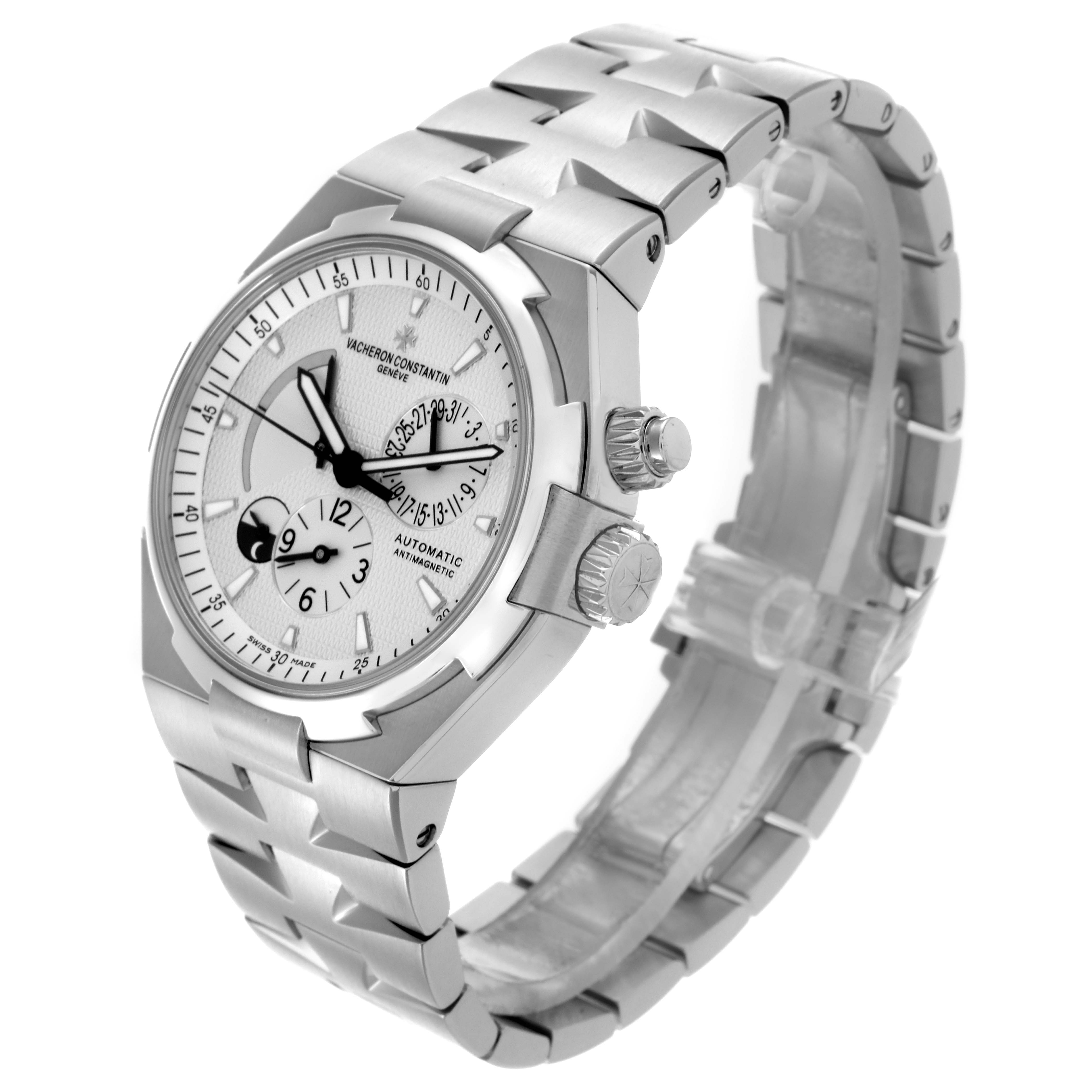 The image shows a Vacheron Constantin Overseas 47450/B01A-9226 Men's Stainless Steel Silver Dial 47450/B01A-9226 Men's Stainless Steel Silver Dial watch at an angled view, highlighting the dial, bracelet, and side crown.