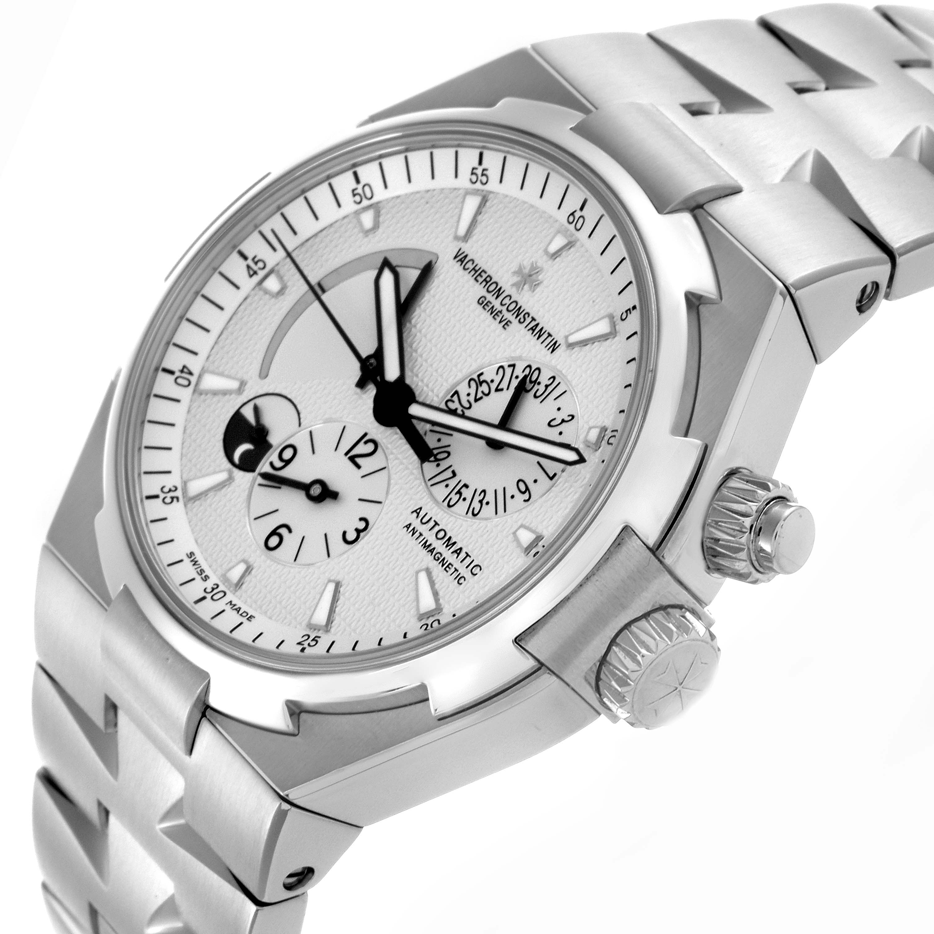 The Vacheron Constantin Overseas 47450/B01A-9226 Men's Stainless Steel Silver Dial 47450/B01A-9226 Men's Stainless Steel Silver Dial model is shown at a three-quarter angle, displaying the face, crown, and part of the bracelet.