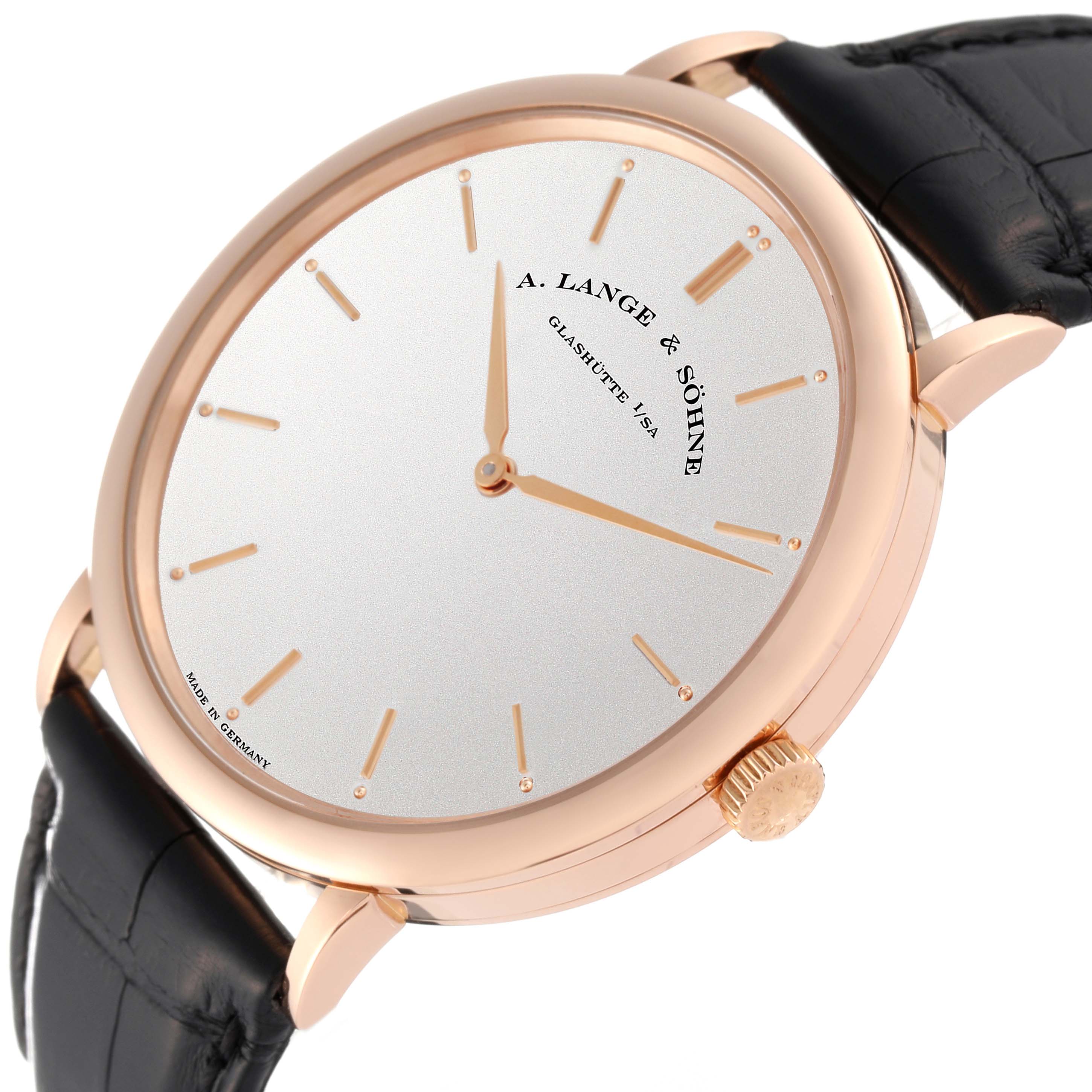 The A. Lange 
Sohne Saxonia 211.032 Men
s Rose Gold Silver Dial watch is shown at a slight side angle featuring its dial, case, crown, and leather strap.