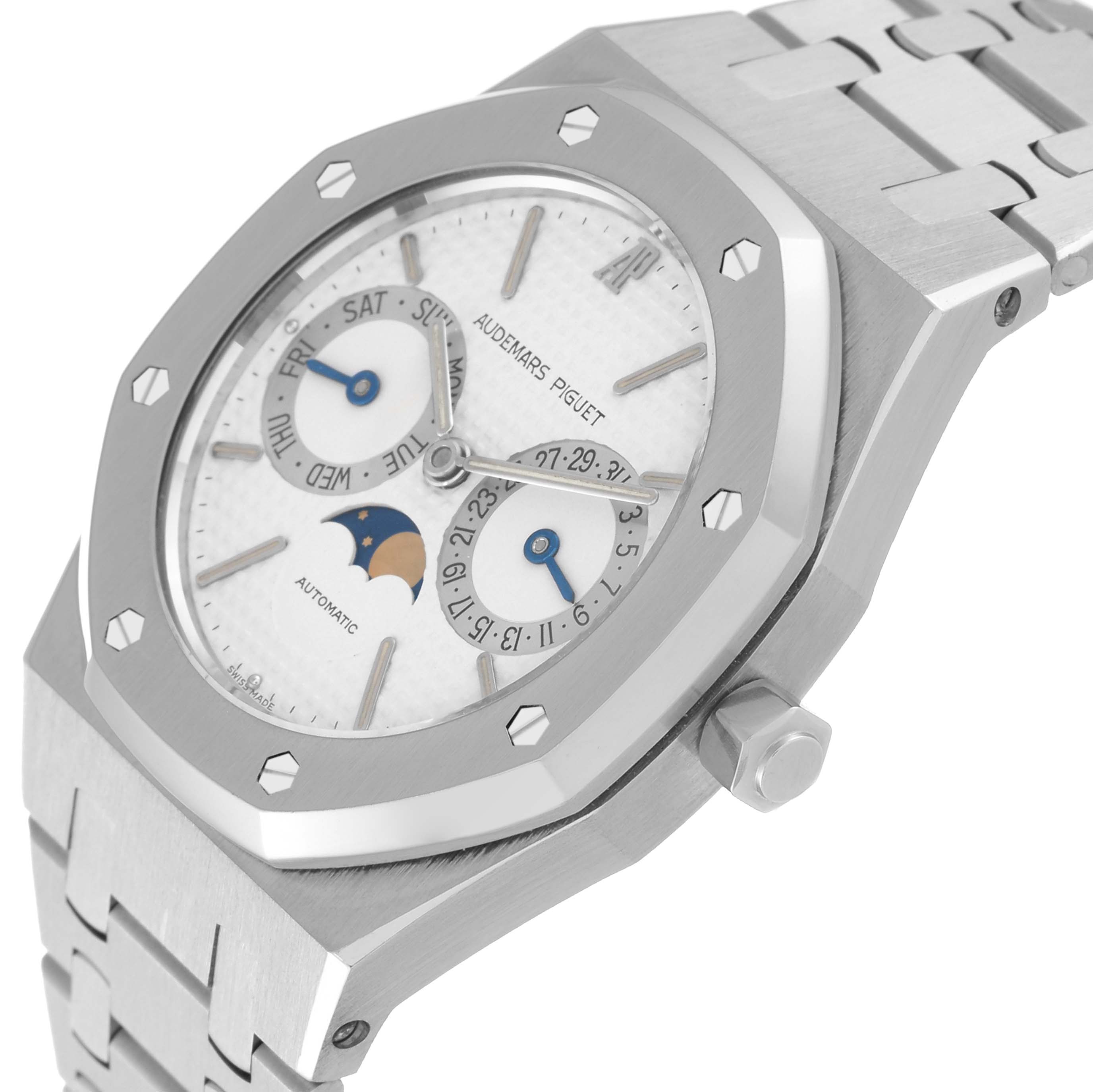 The image shows a side-angle view of the Royal Oak by Audemars Piguet, highlighting the bezel, dial, crown, and part of the bracelet.