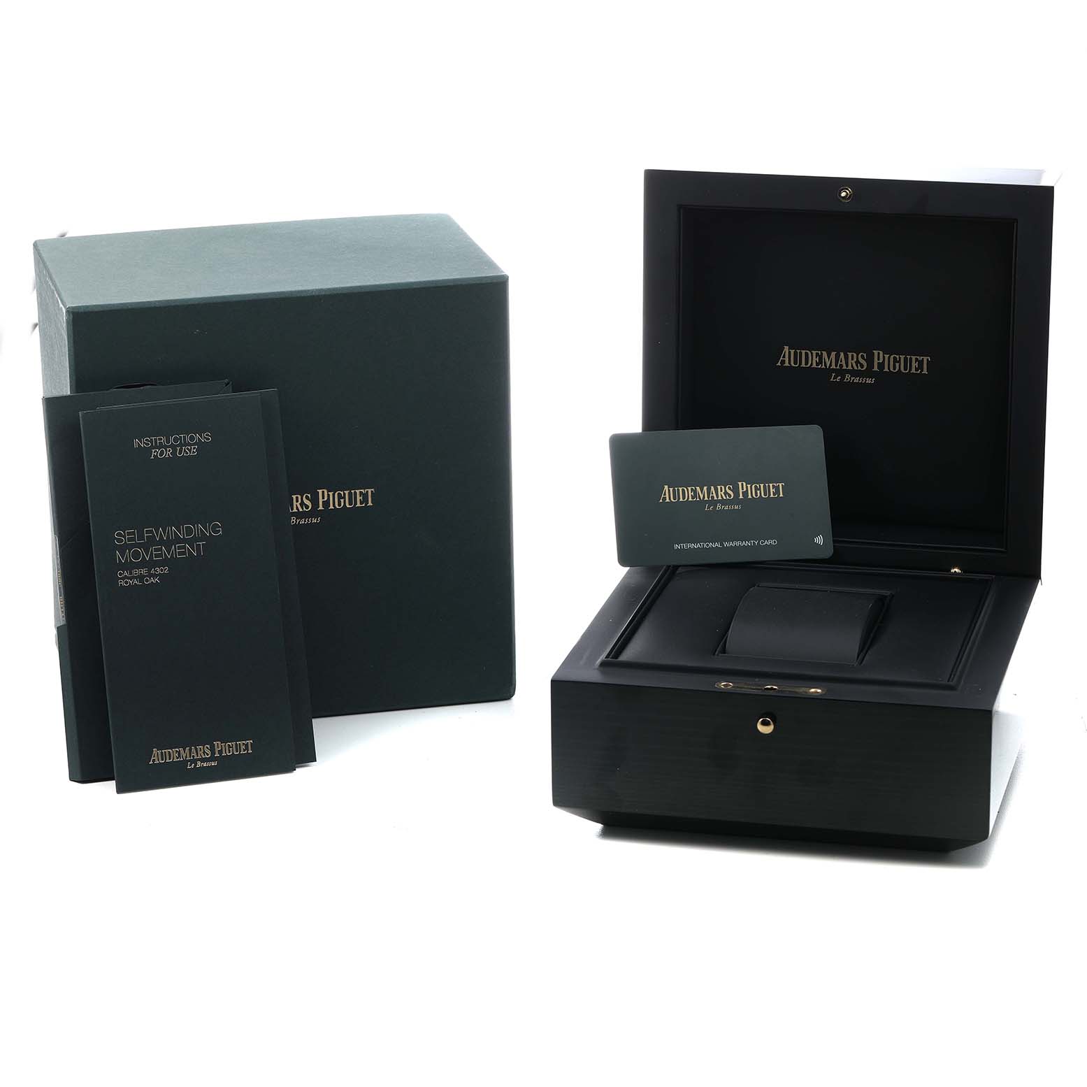 The image shows the Royal Oak by Audemars Piguet packaging, including the box, manual, and warranty card.
