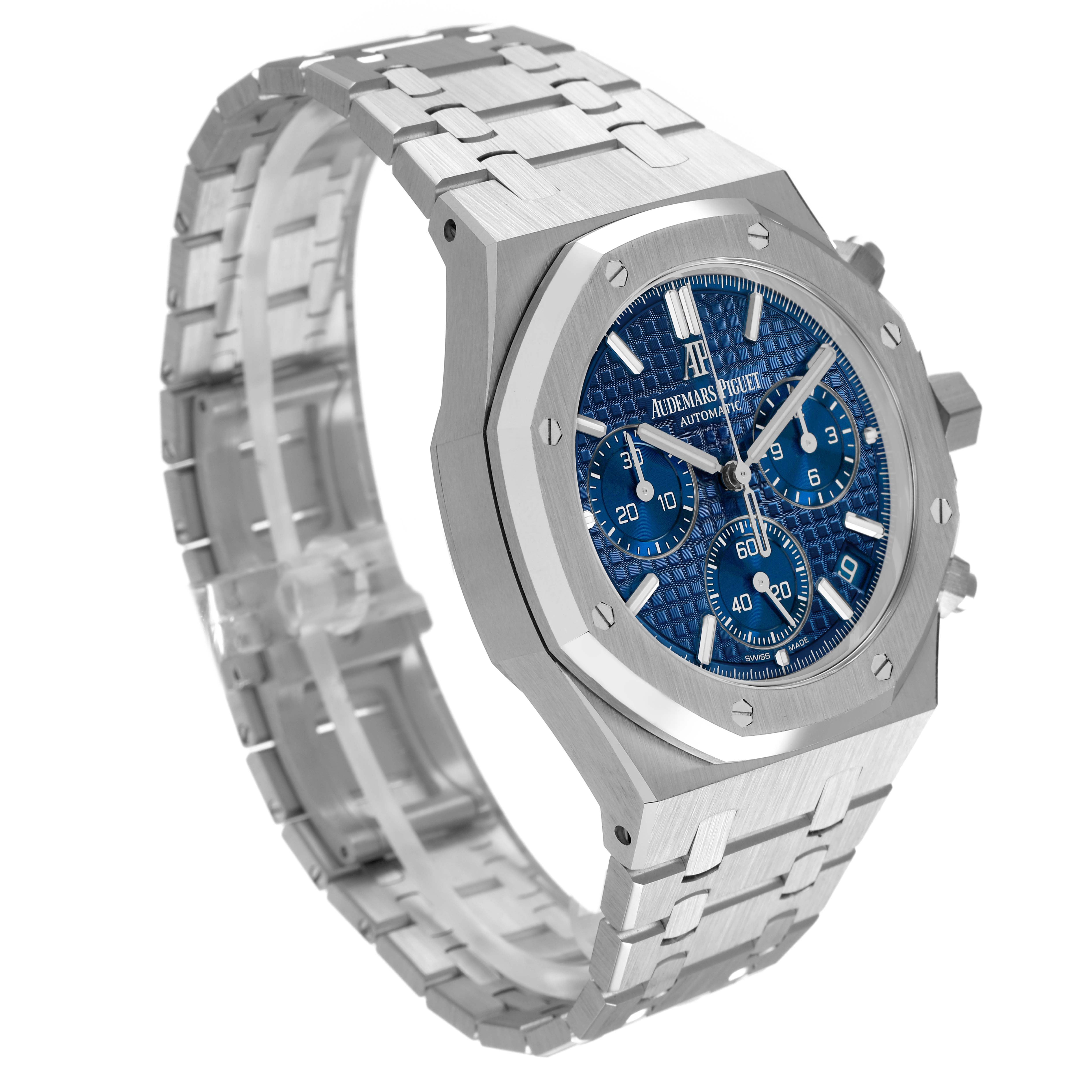 The Audemars Piguet Royal Oak 26239BC.OO.1220BC.01 Men's White Gold Blue Dial watch is shown at a three-quarter angle, highlighting its blue dial, octagonal bezel, and stainless steel bracelet.