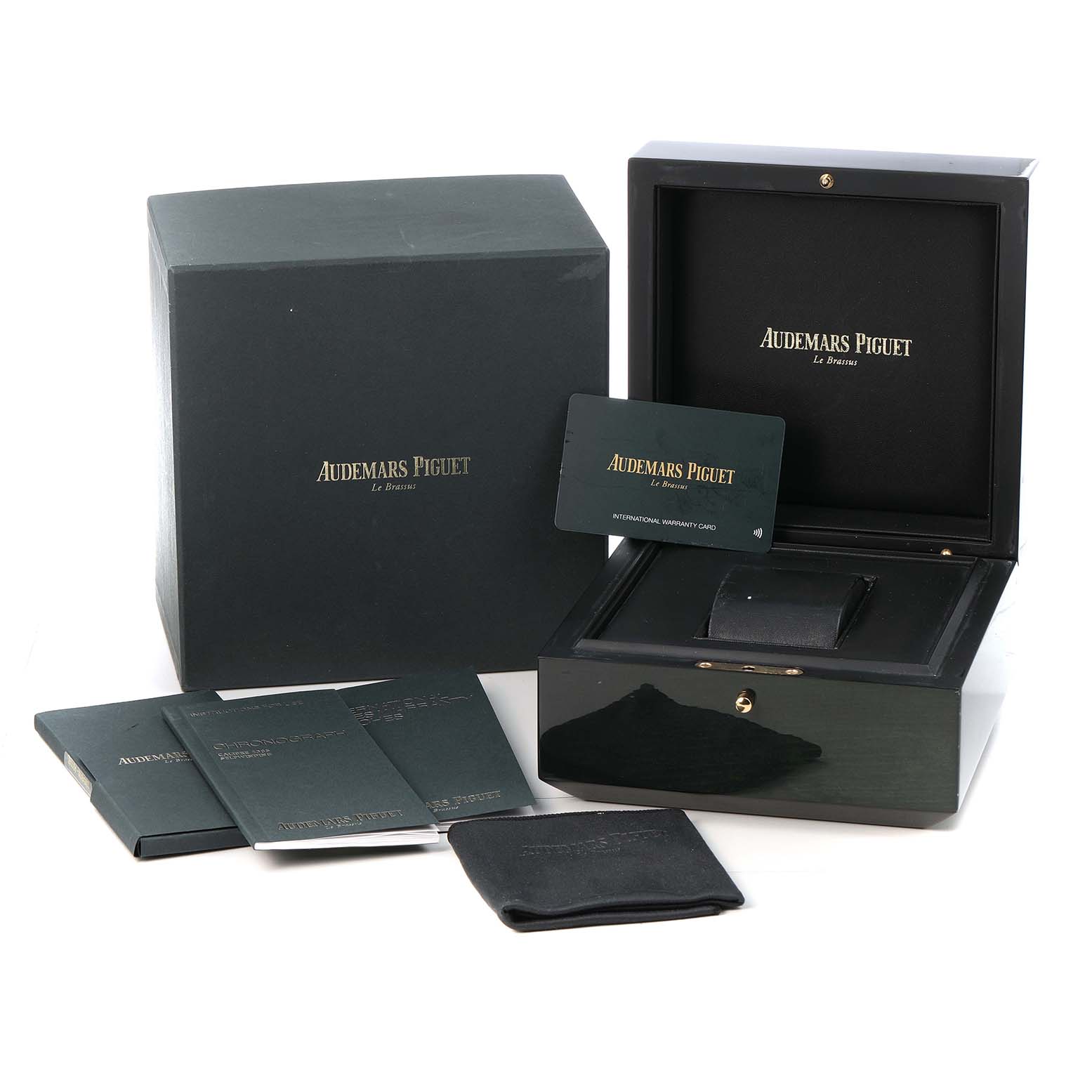 The image shows the Audemars Piguet Royal Oak 26239BC.OO.1220BC.01 Men's White Gold Blue Dial watch box, warranty card, manuals, and accessories from a frontal angle.