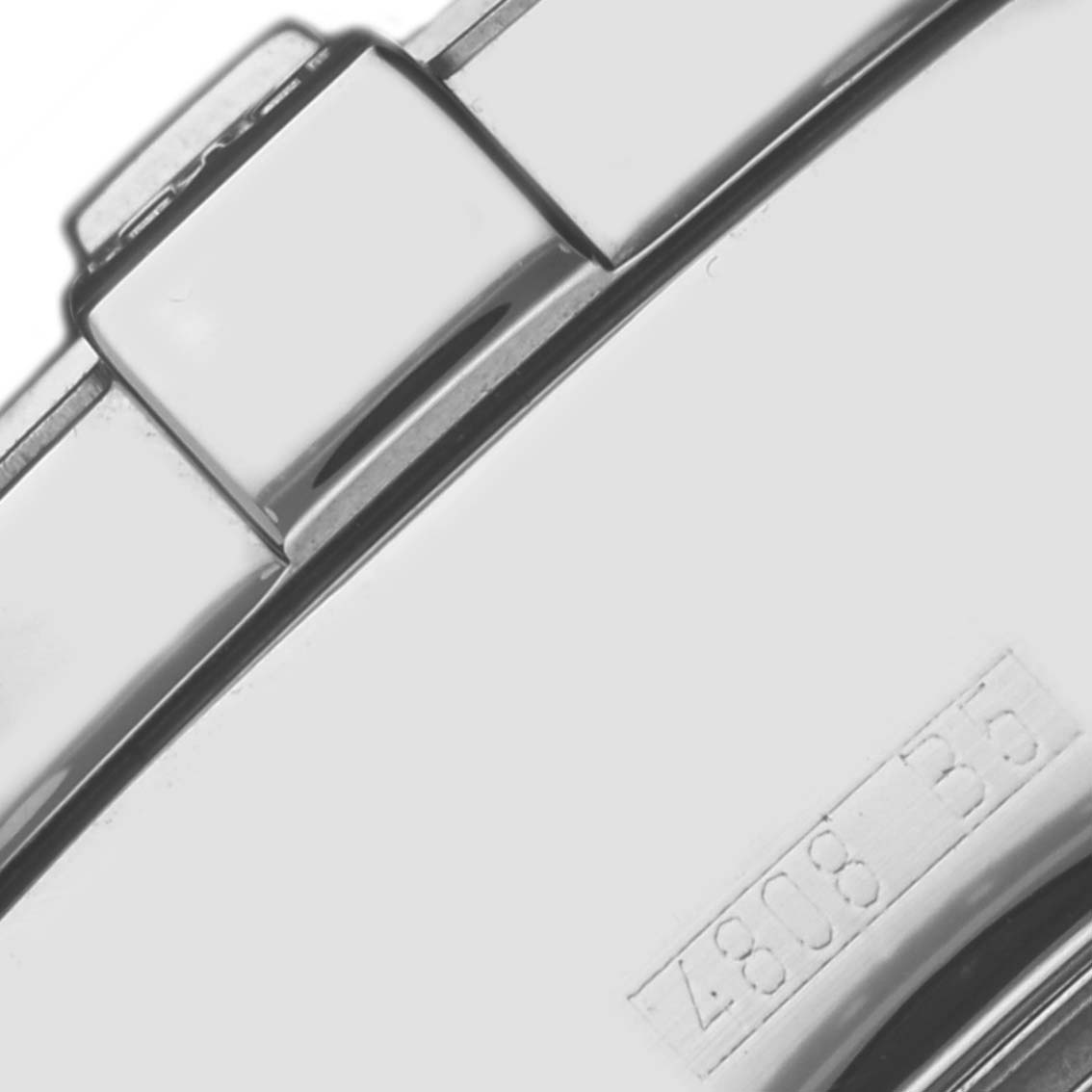 The image shows a close-up of a clasp from a Breitling Superocean A13340 Men's Stainless Steel Beige Dial A13340 Men's Stainless Steel Beige Dial watch, highlighting its polished metal surface and engraved numbers.