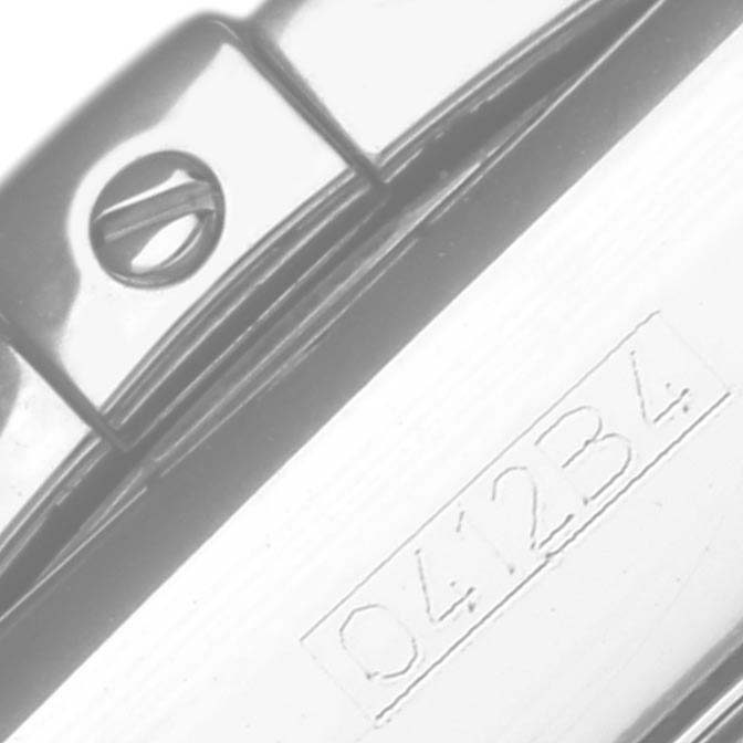 The image shows part of a Breitling Chronomat AB0110 Men's Stainless Steel Mother of Pearl Dial AB0110 Men's Stainless Steel Mother of Pearl Dial watch, focusing on a close-up of the strap fastener and engraved model number.