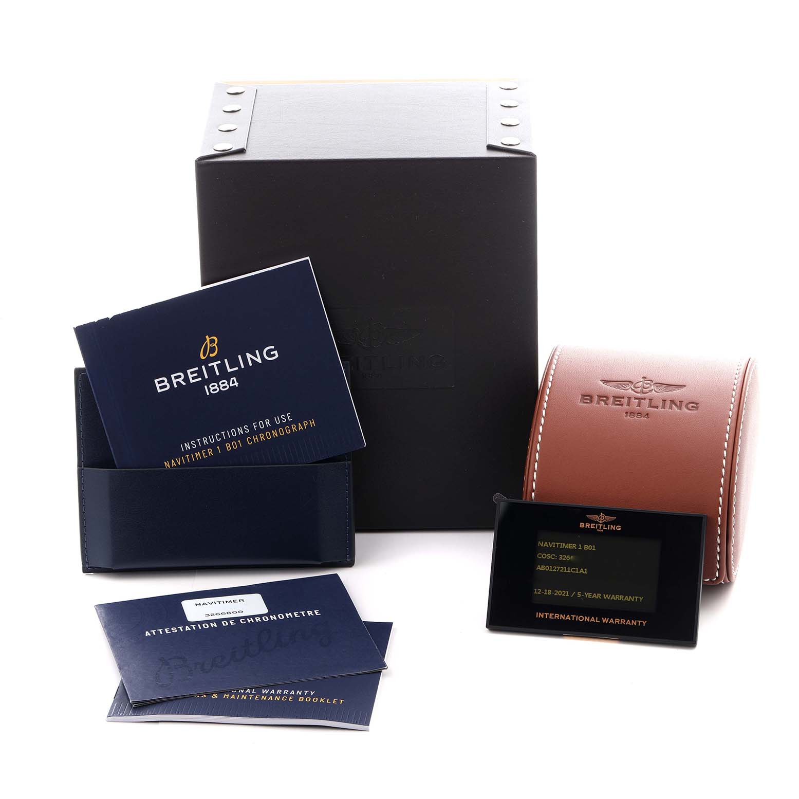 The image shows the packaging and accessories for a Breitling Navitimer AB0127 Men's Stainless Steel Blue Dial AB0127 Men's Stainless Steel Blue Dial, including a box, leather case, booklets, and a warranty card.