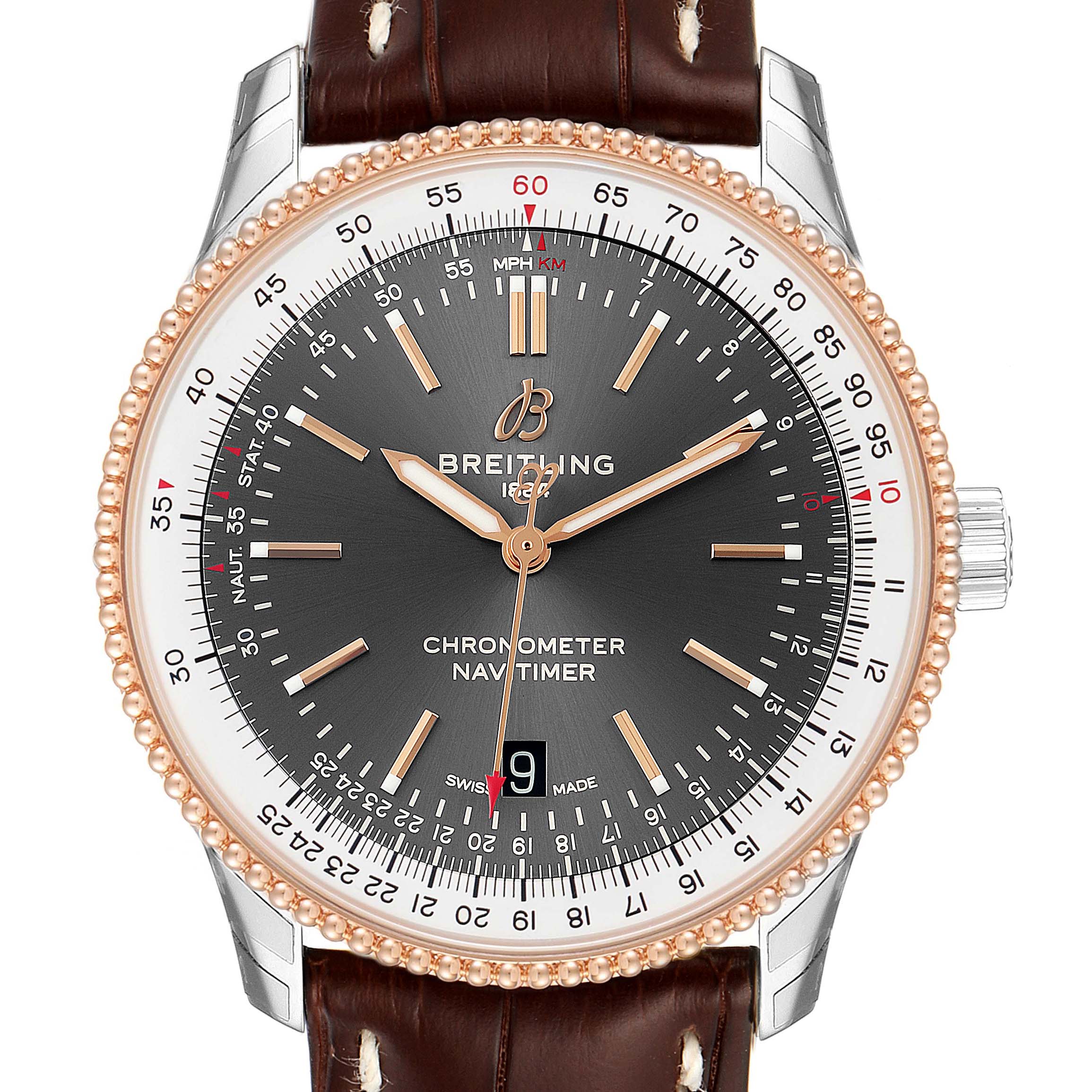 The image shows a front view of the Breitling Navitimer U17326211M1P1 Men
s Stainless Steel Grey Dial U17326211M1P1 Men
s Stainless Steel Grey Dial watch face and part of its brown leather strap.