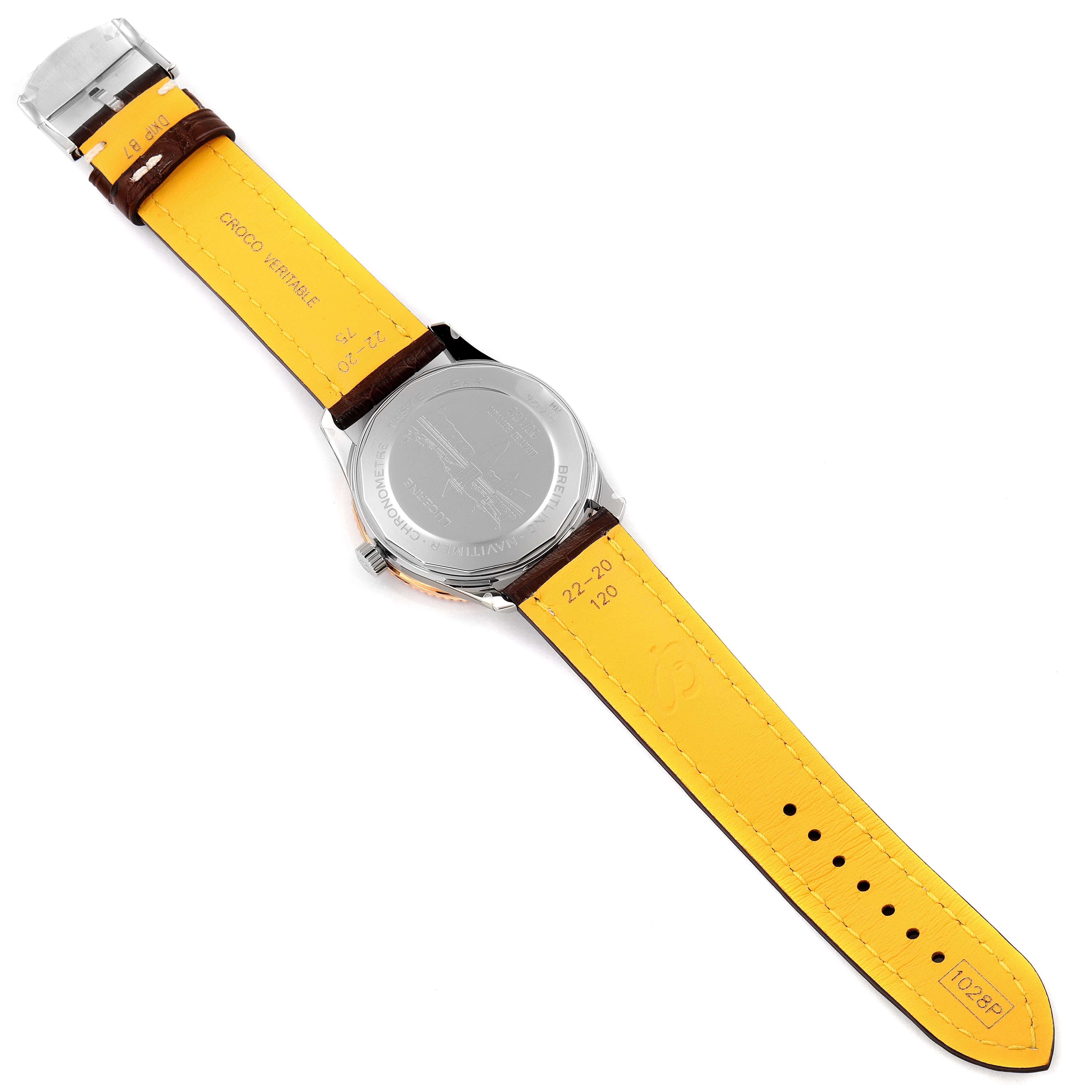 The Breitling Navitimer U17326211M1P1 Men
s Stainless Steel Grey Dial U17326211M1P1 Men
s Stainless Steel Grey Dial watch is shown from the back, with its case back and yellow inner leather strap visible.