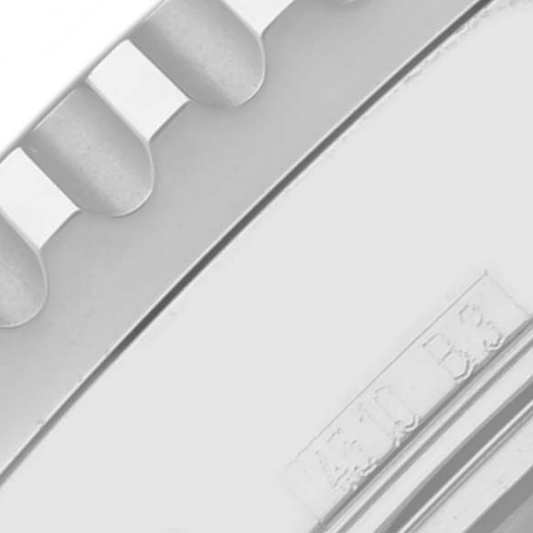 The image shows a close-up of the edge of the bezel and part of the case of a Breitling Navitimer A23322 Men's Stainless Steel Silver Dial A23322 Men's Stainless Steel Silver Dial watch.