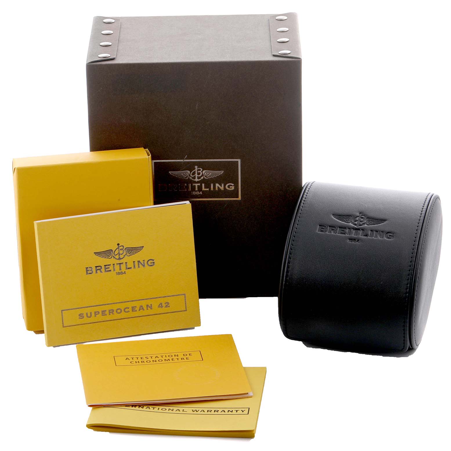 The image shows the packaging and documents of a Breitling Superocean A17364 Men's Stainless Steel Black Dial A17364 Men's Stainless Steel Black Dial, including a box, a case, and warranty booklets.