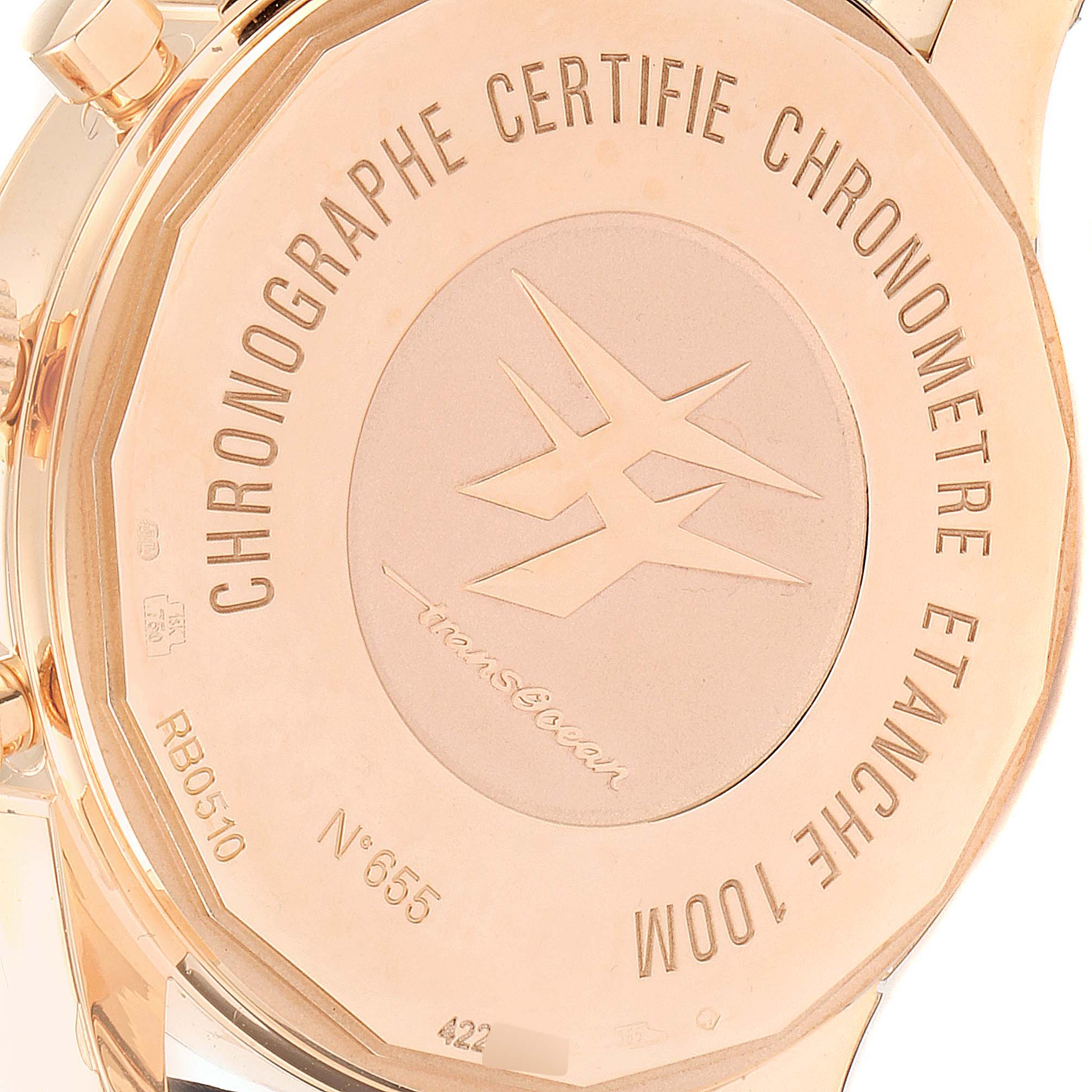 The image shows the backside of a Breitling Transocean RB0510U4-BB63BKLD Men's Rose Gold White Dial RB0510U4-BB63BKLD Men's Rose Gold White Dial watch, featuring the model's engravings and logo.