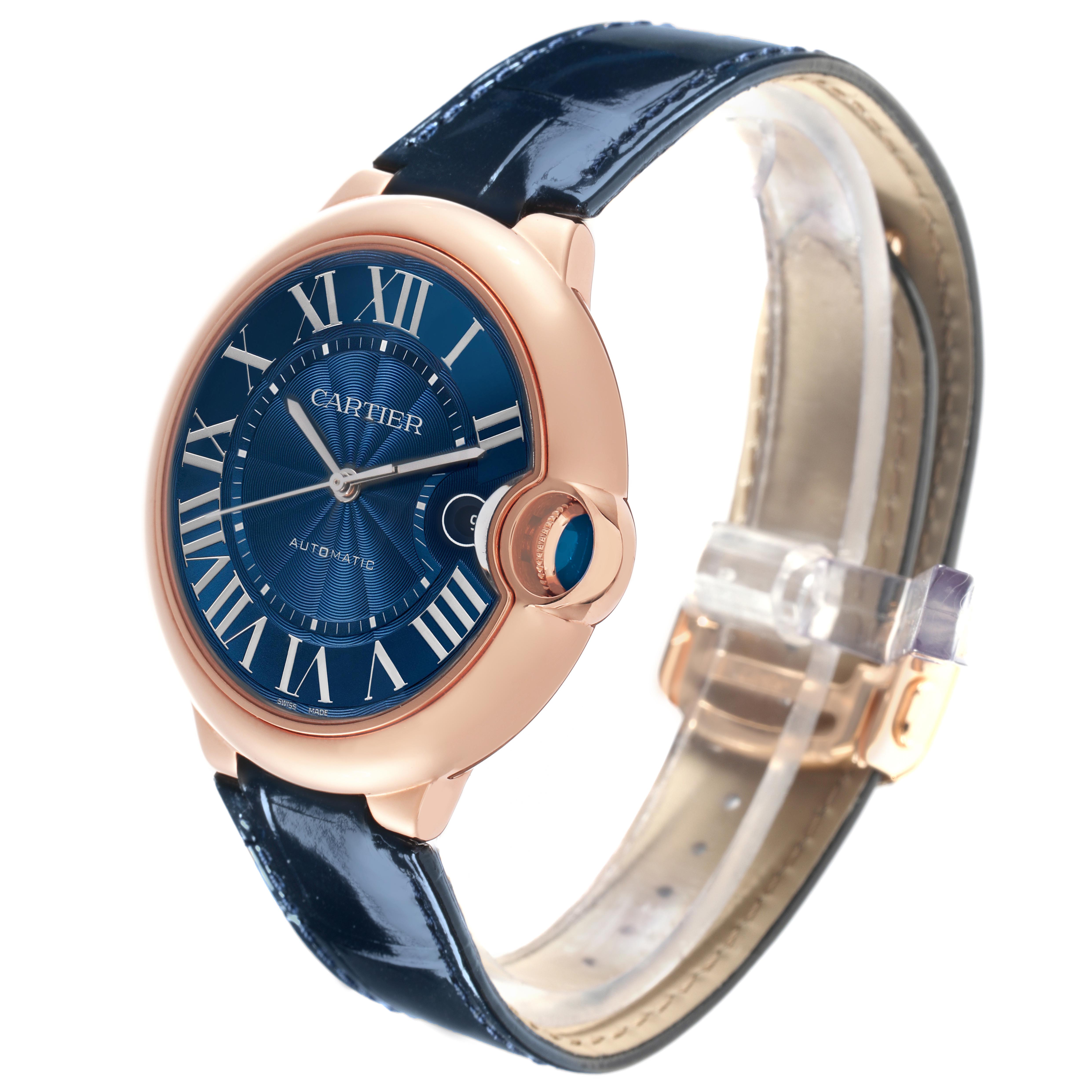 The Cartier Ballon Bleu WGBB0036 Men's Rose Gold Blue Dial WGBB0036 Men's Rose Gold Blue Dial watch is shown at a side angle, displaying the face, crown, and leather strap.