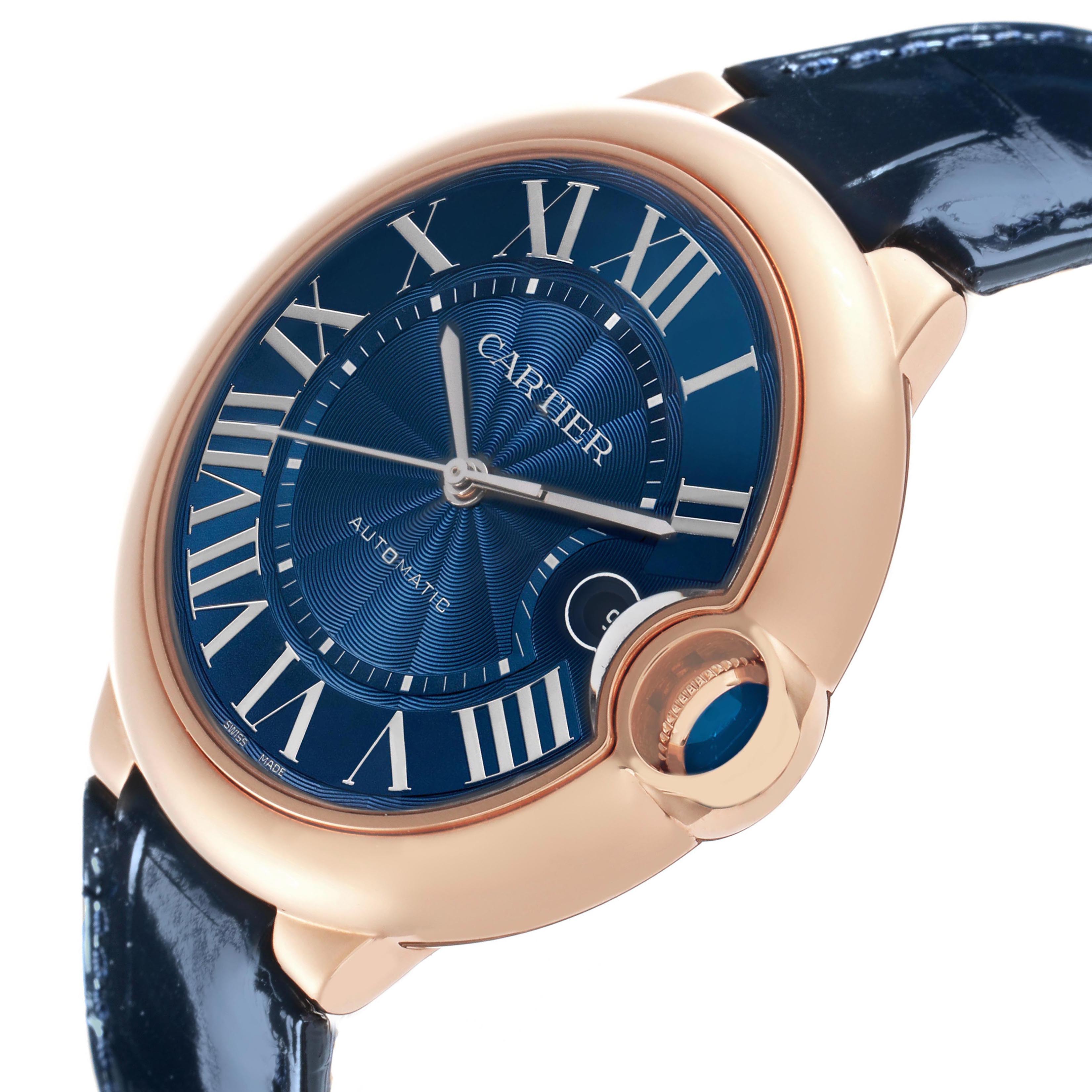 The Cartier Ballon Bleu WGBB0036 Men's Rose Gold Blue Dial watch is shown at a slight angled close-up, highlighting the face, crown, and part of the bracelet.