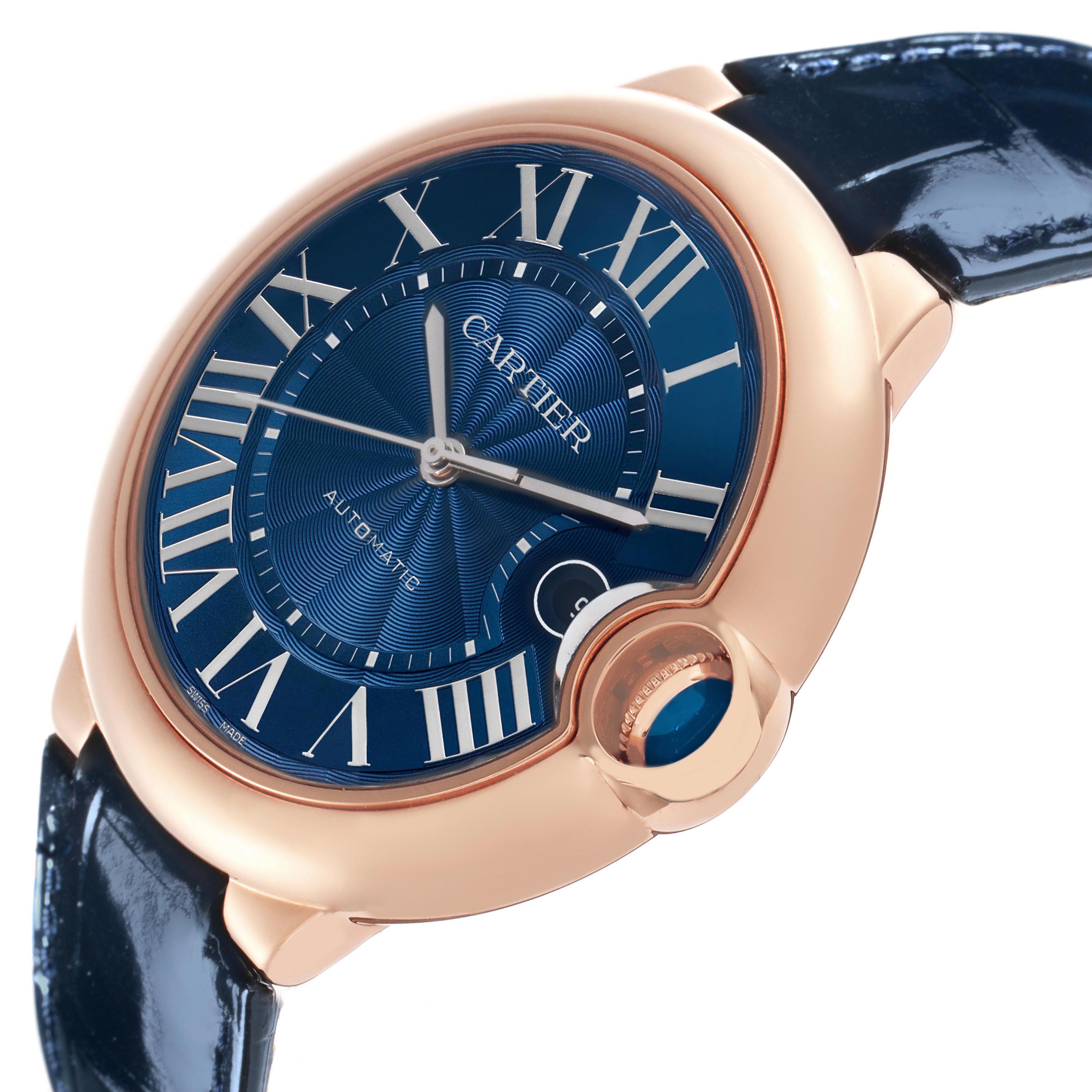 The Cartier Ballon Bleu WGBB0036 Men's Rose Gold Blue Dial watch is shown at a slight angle, highlighting its blue dial, Roman numerals, gold case, and leather strap.