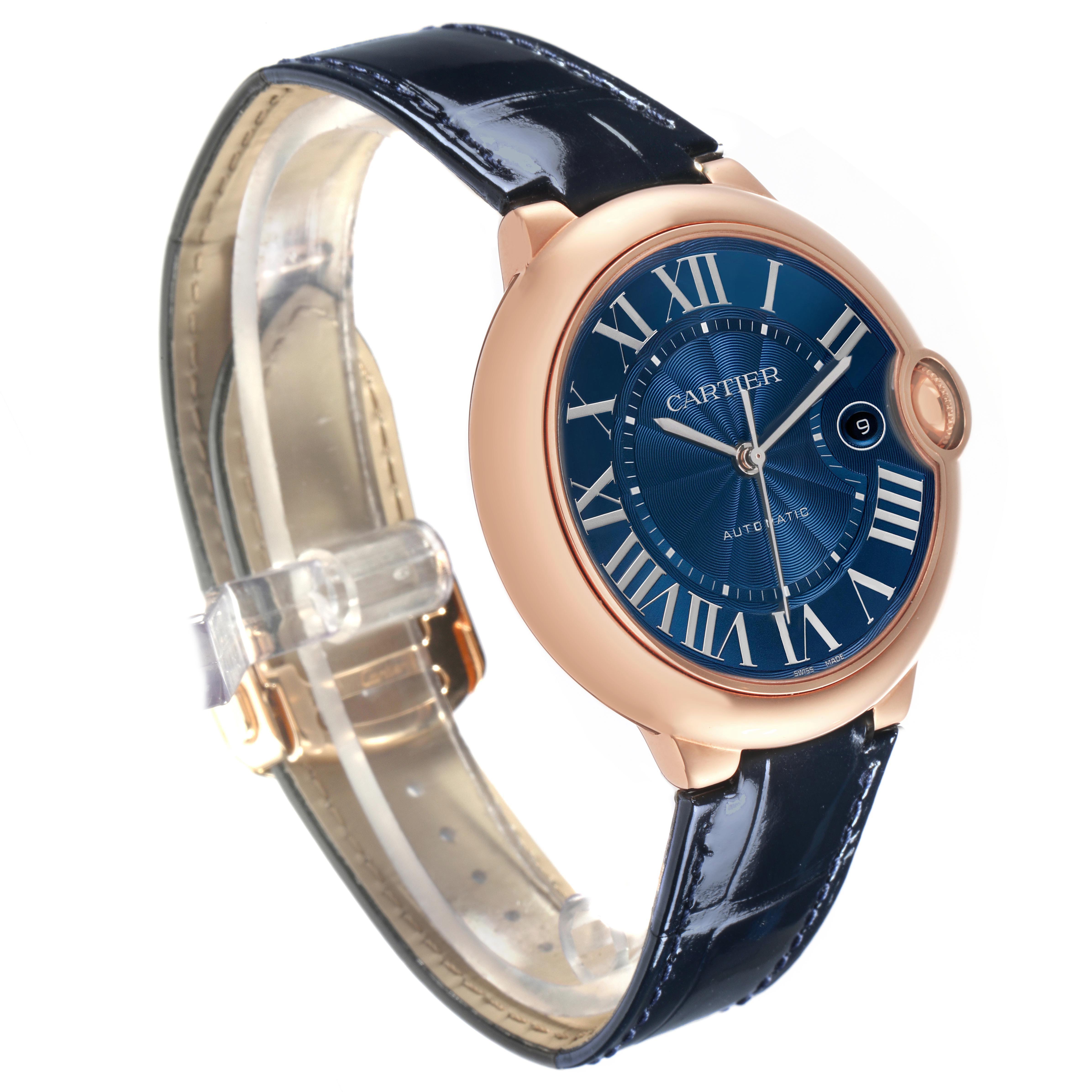 The Cartier Ballon Bleu WGBB0036 Men's Rose Gold Blue Dial watch is shown at an angled side view, highlighting its blue dial, gold case, and matching leather strap.