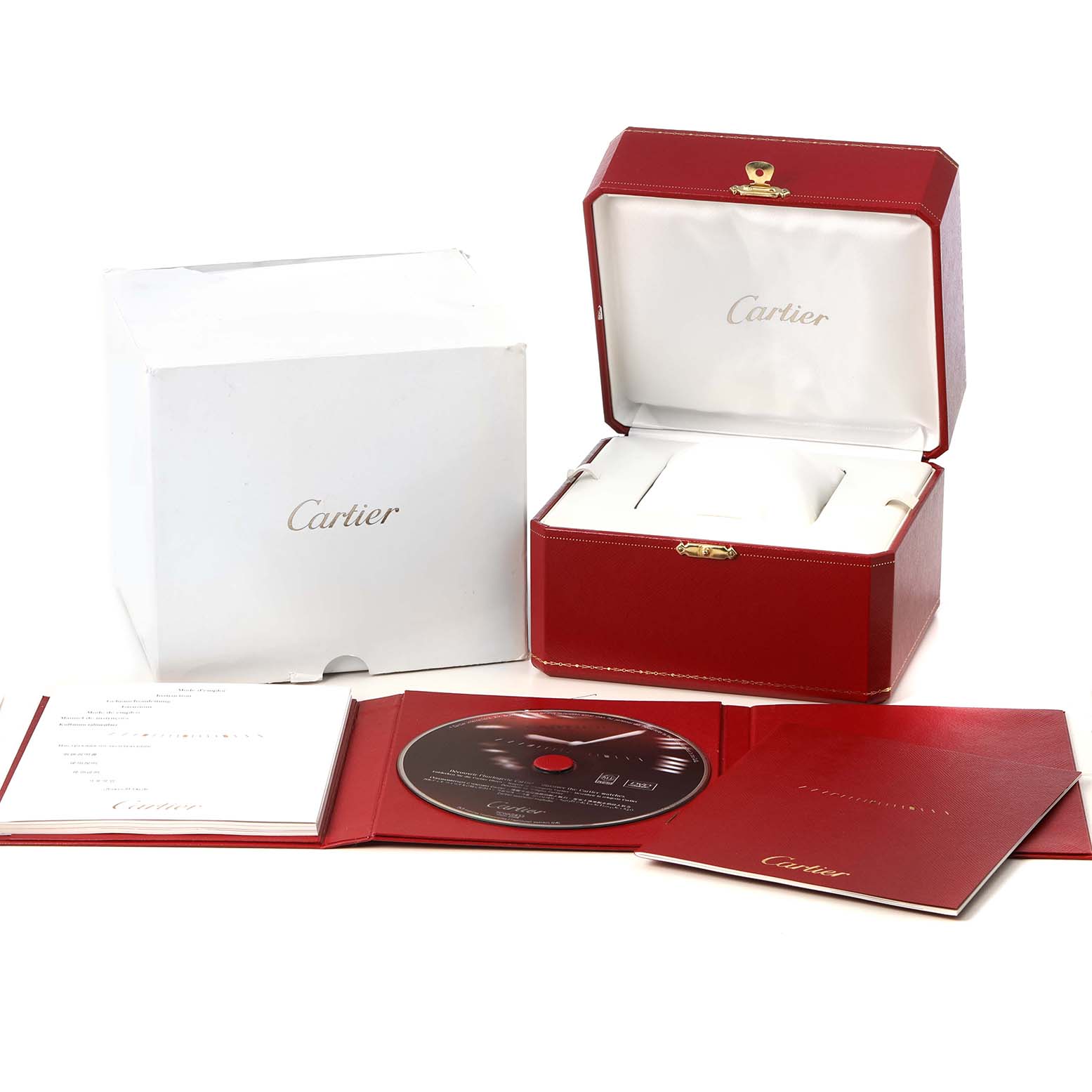 The image shows a Cartier Roadster W62025V3 Men's Stainless Steel Silver Dial watch box, CD, manual, and red packaging at an angle.