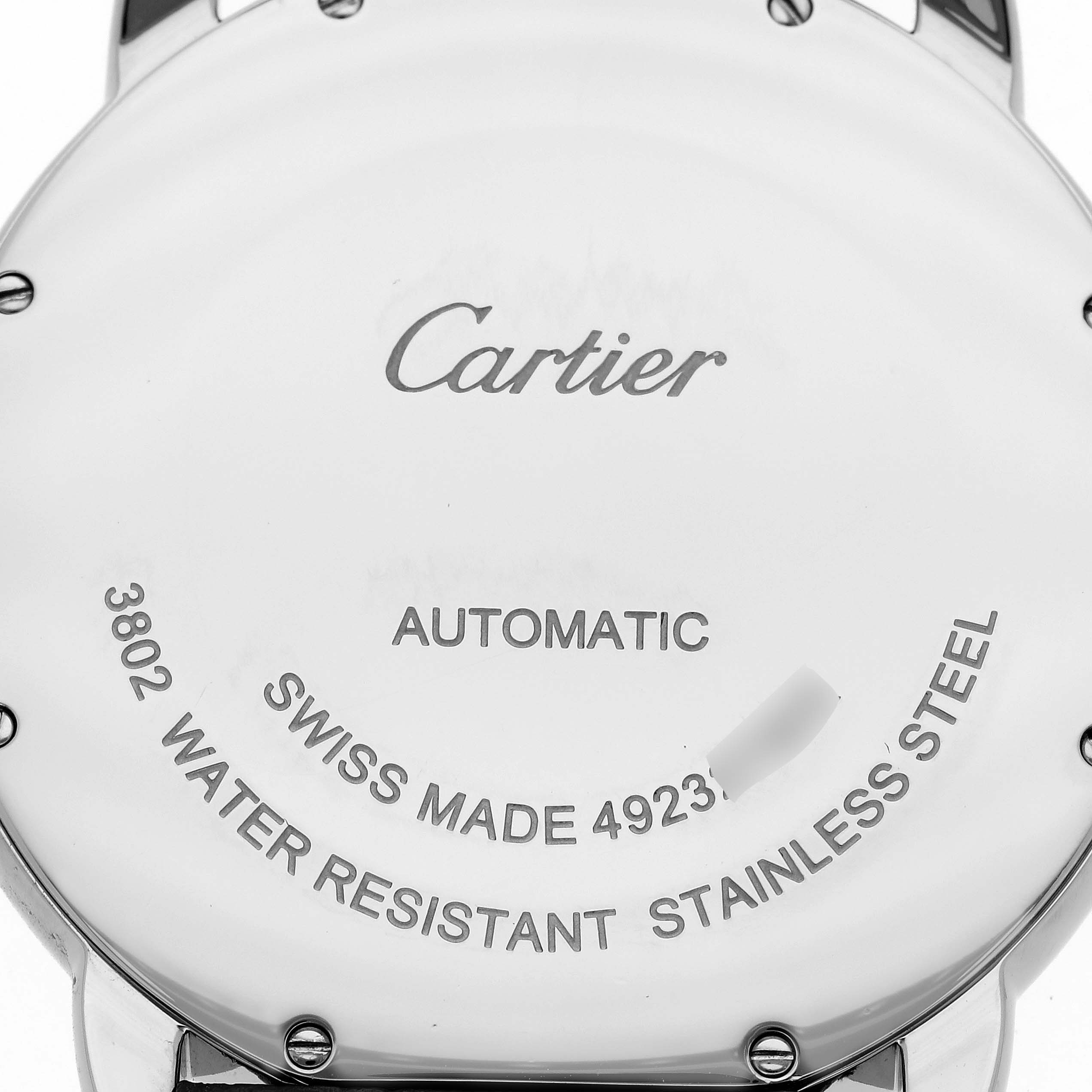 This is a close-up of the back case of a Cartier Ronde W6701010 Men
s Stainless Steel Silver Dial W6701010 Men
s Stainless Steel Silver Dial watch, showing engraving details and text.